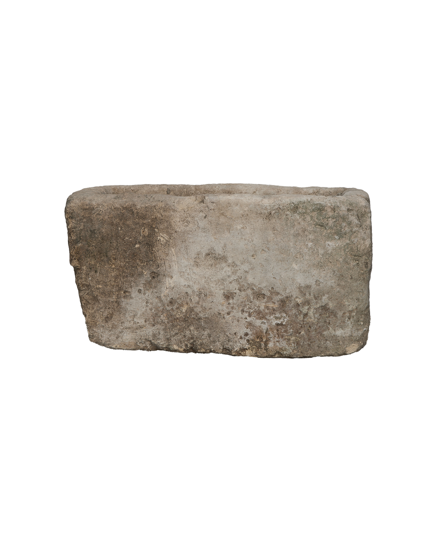 Vintage Indonesian rectangular limestone trough showing texture, condition, and full side view.