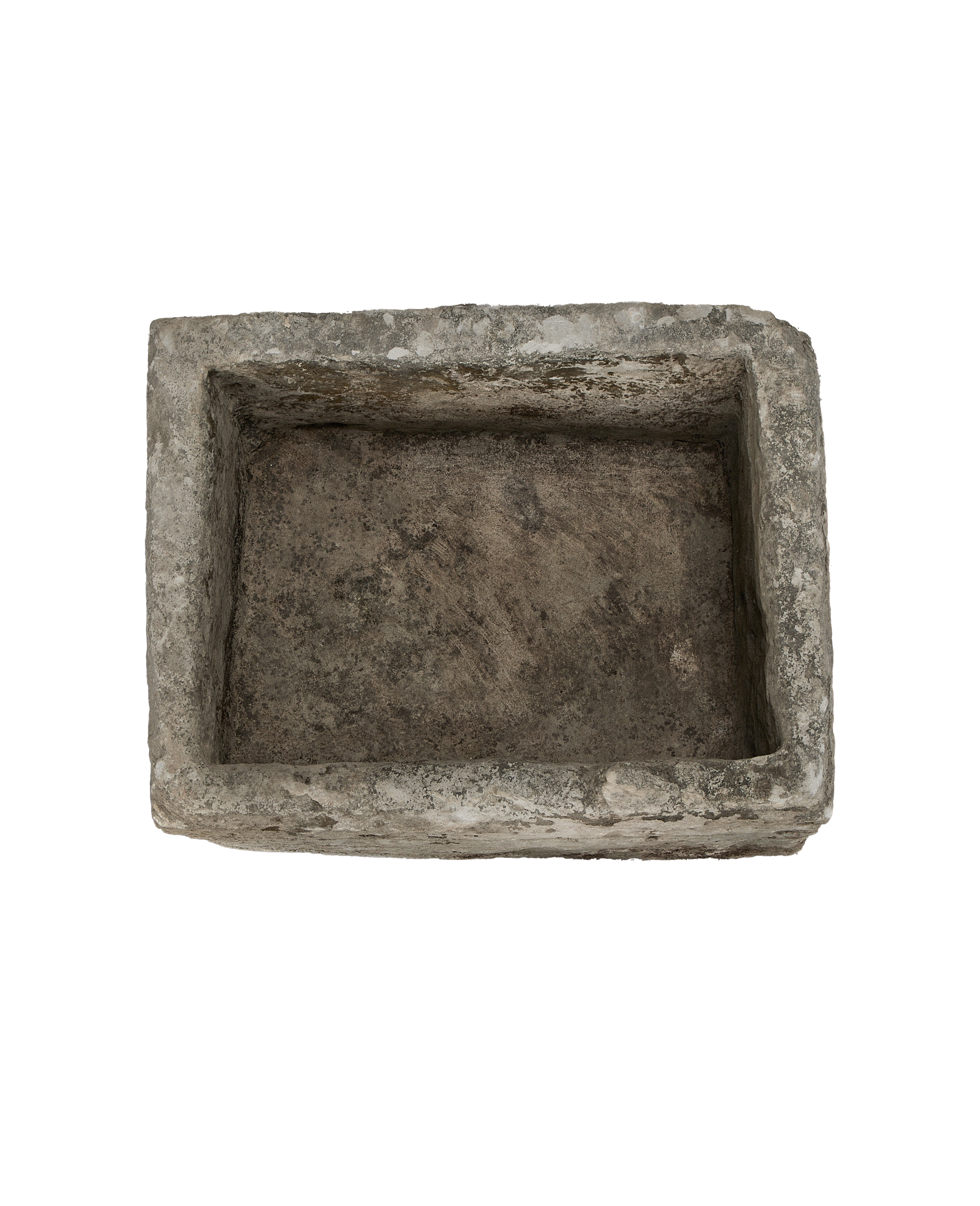 Overhead view of vintage rectangular Indonesian limestone trough with rough, weathered interior.