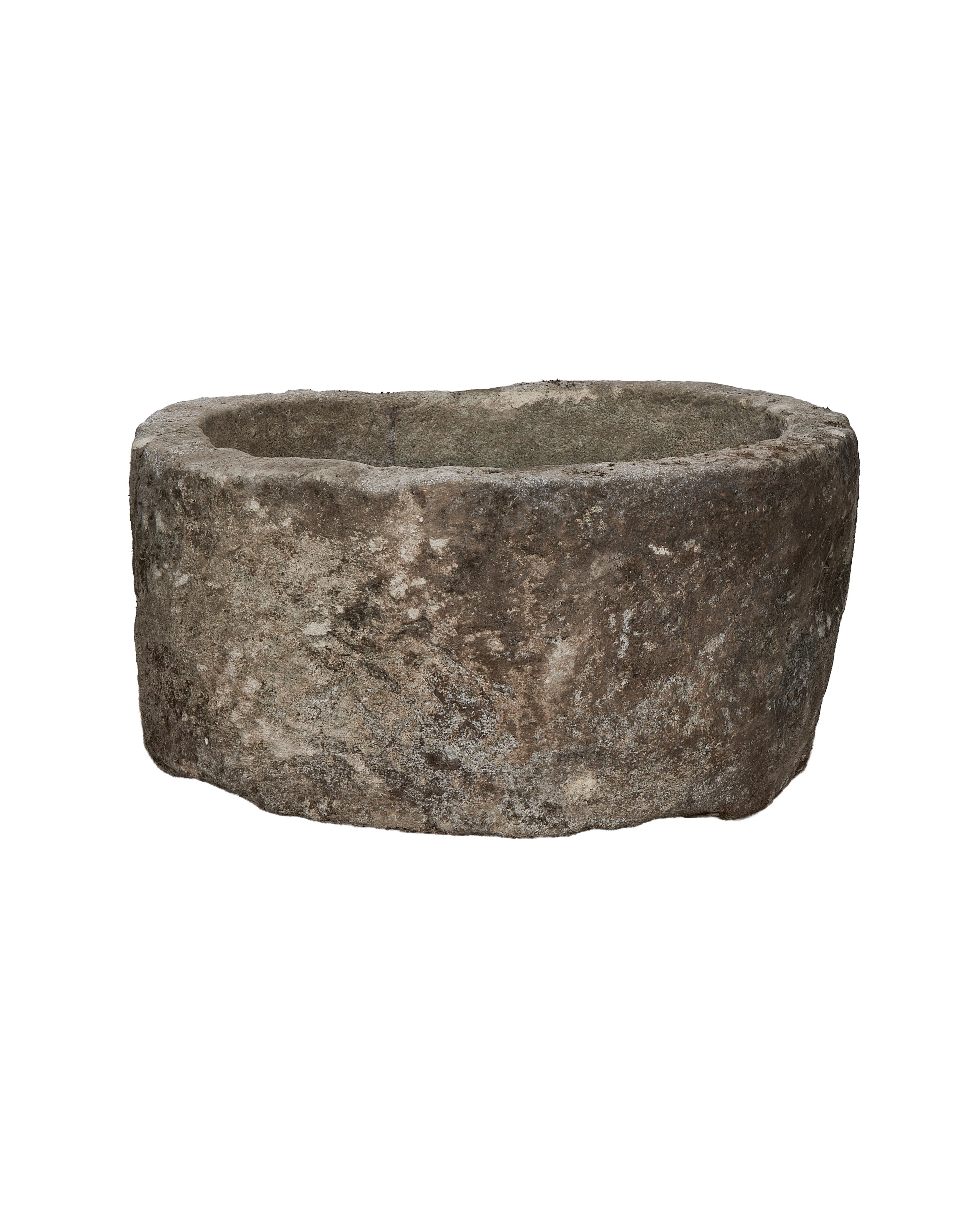 Vintage round limestone trough, side profile showcasing rough texture and natural patinas, Indonesian antique.