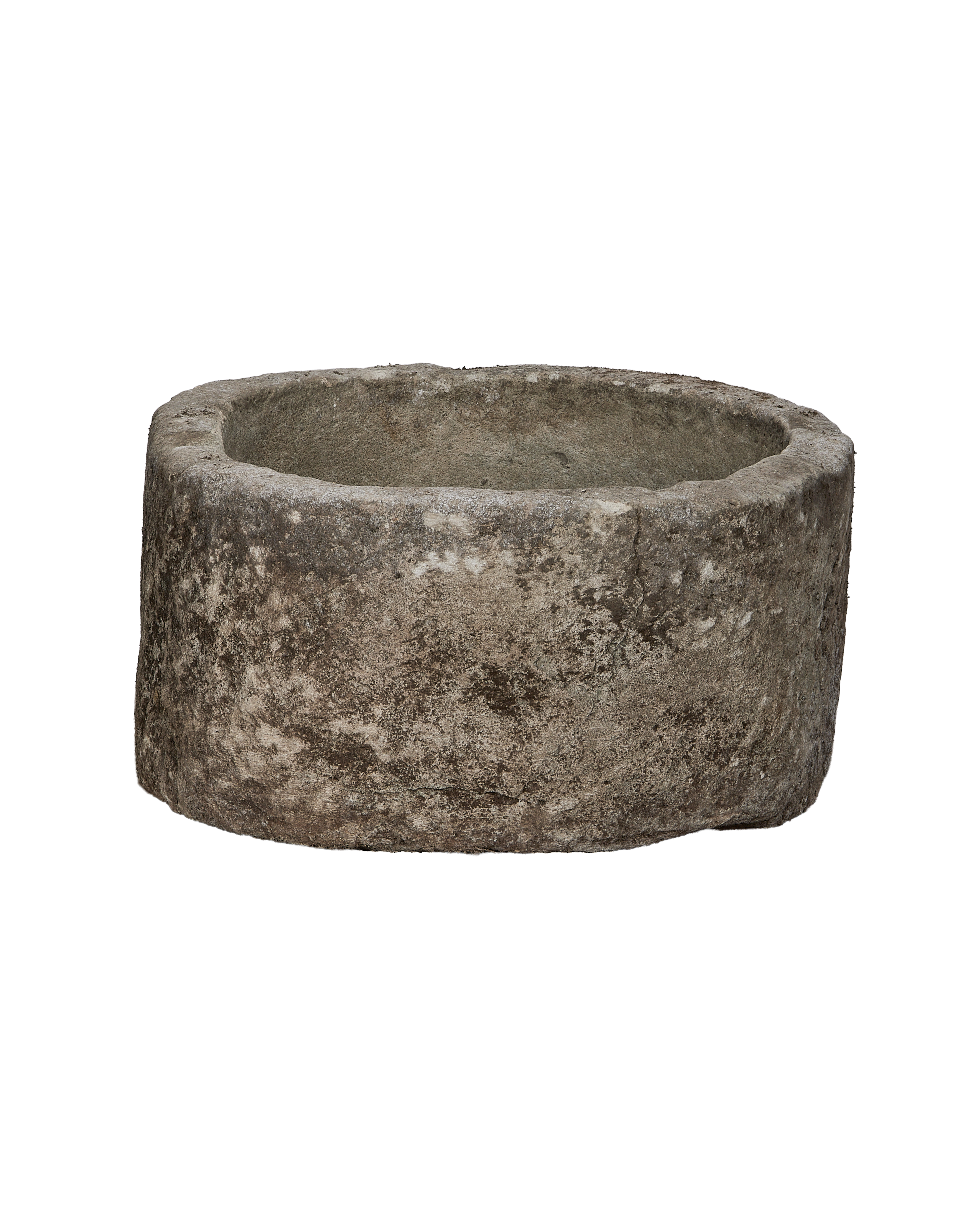 Vintage round limestone trough, side profile, revealing exterior texture and inner depth.