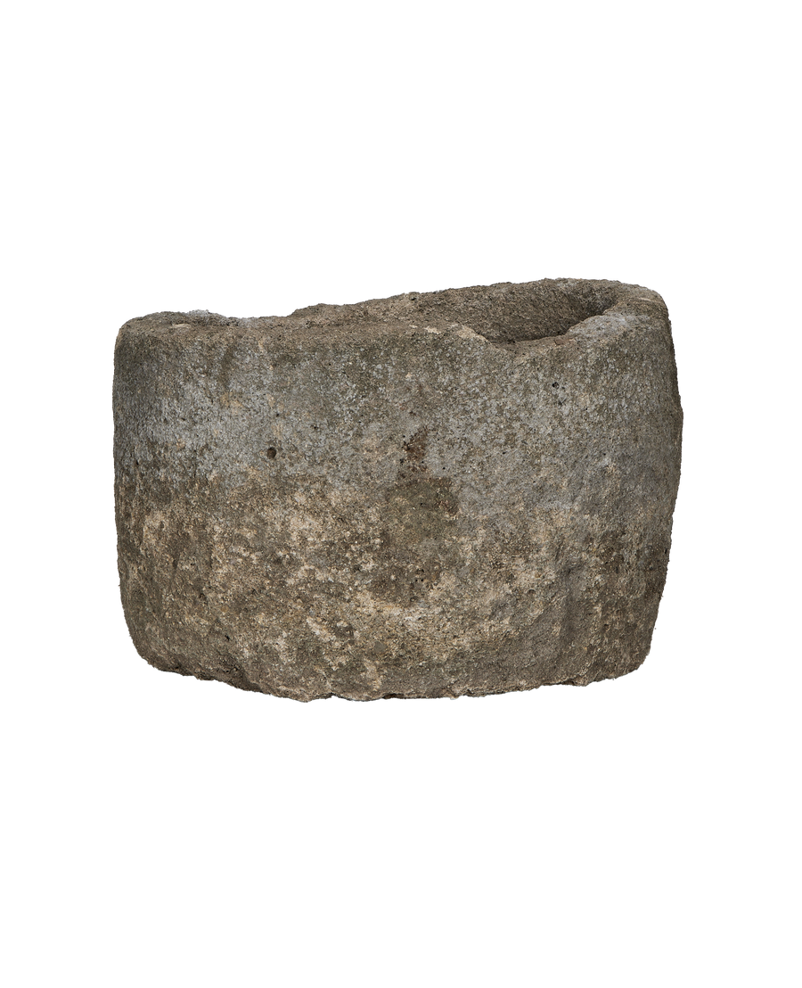 Vintage Indonesian round limestone trough, showing weathered texture and natural imperfections.