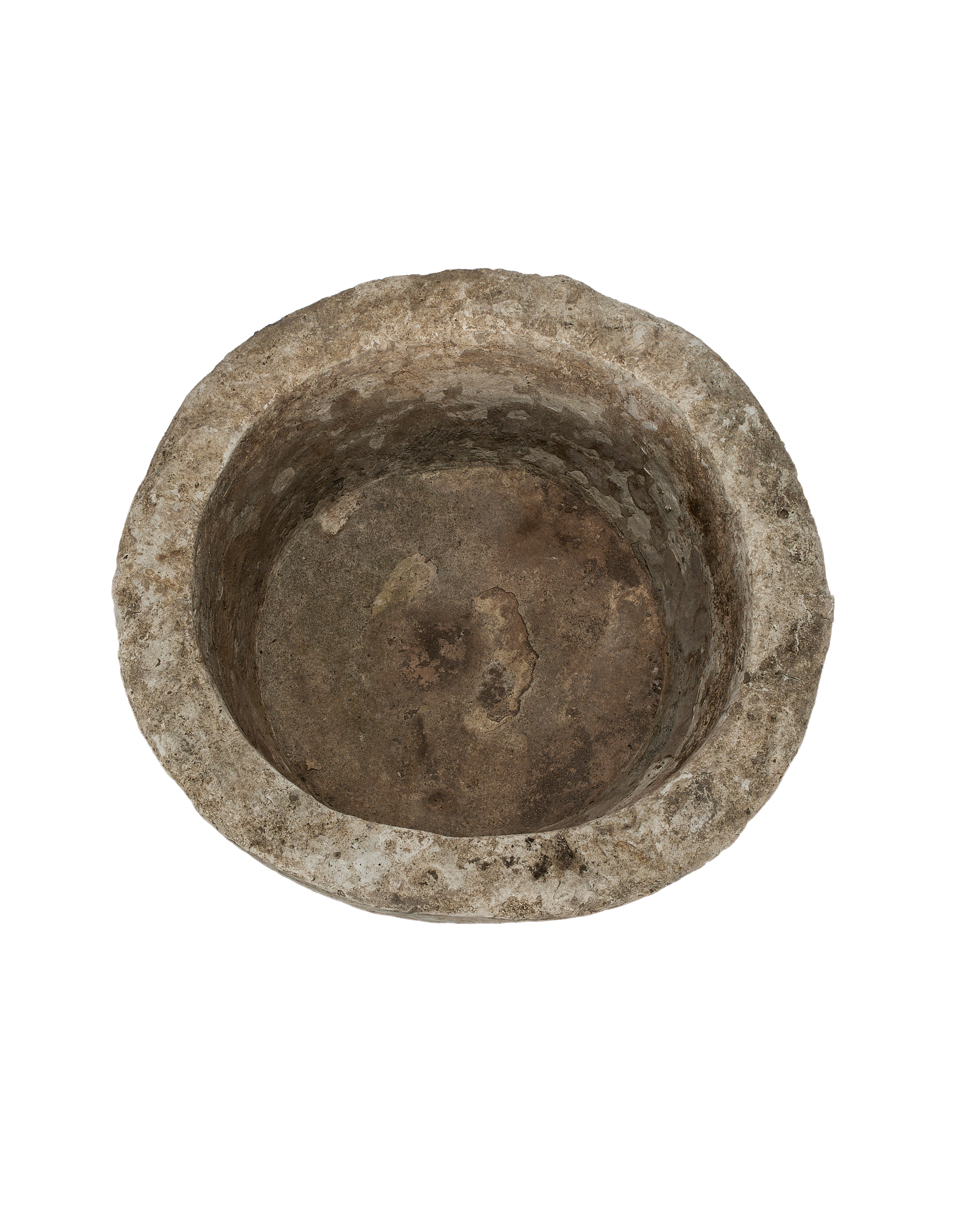 Vintage Indonesian round limestone trough, top-down view showing interior texture and depth.