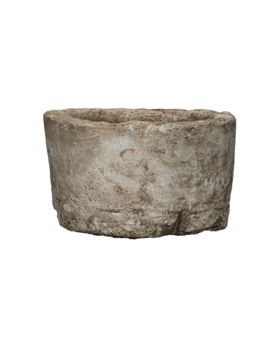 Vintage round Indonesian limestone trough, grey with natural texture, full view.