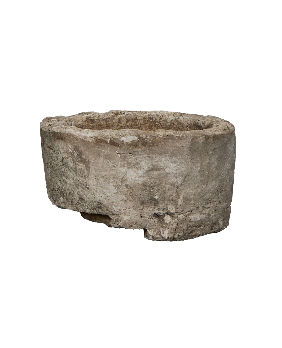 Vintage Indonesian round limestone trough, showing weathered texture and natural imperfections from above.