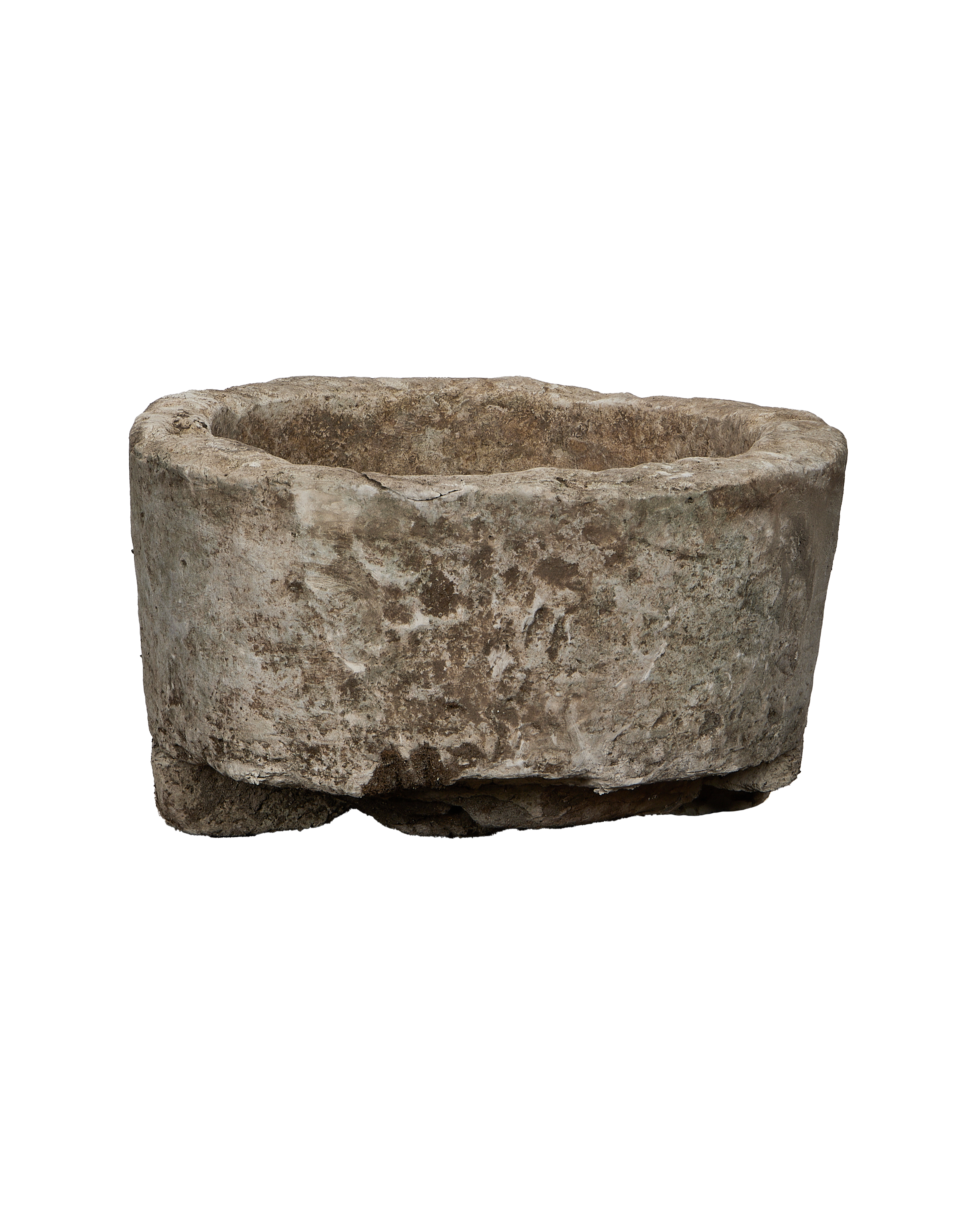 Vintage Indonesian brown limestone trough, weathered surface texture close-up, rugged base detail.