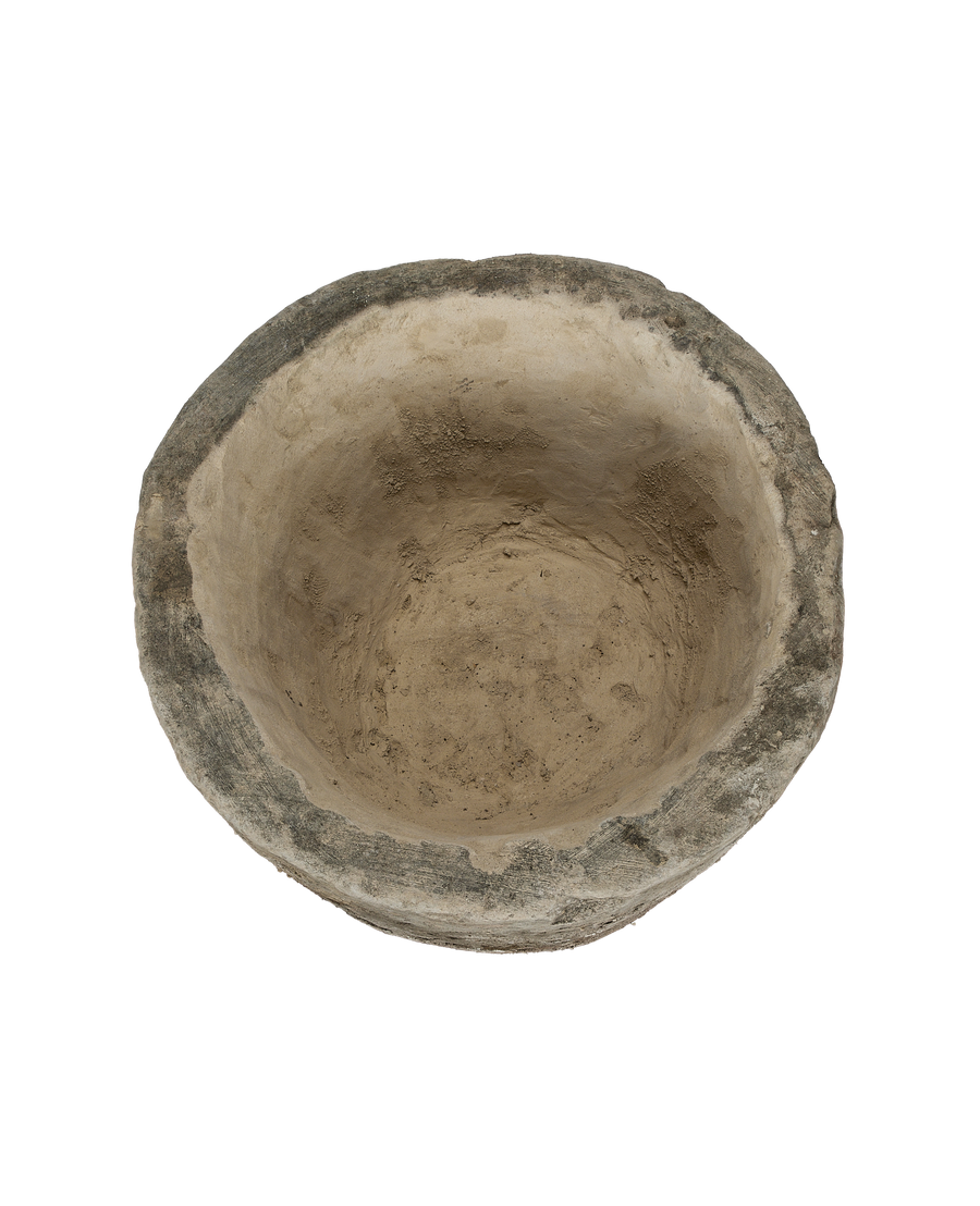 Vintage Indonesian round limestone trough, top-down view showing weathered gray rim.