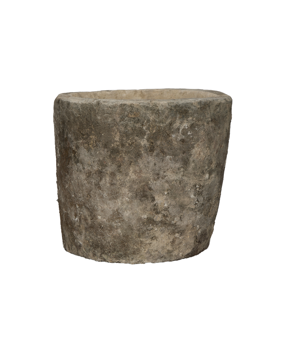 Vintage Indonesian round limestone trough, showing weathered texture and uneven rim detail.