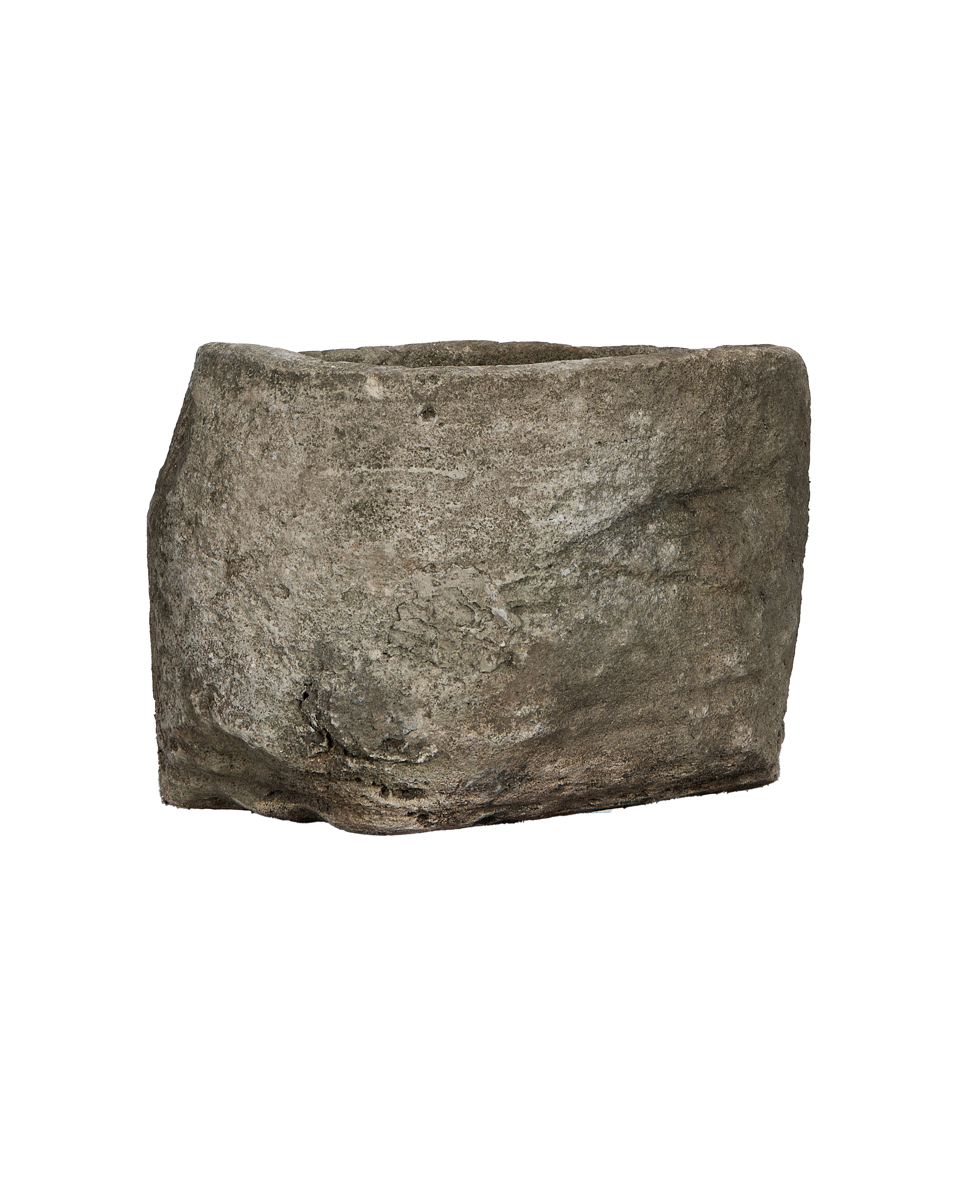 Vintage Indonesian round limestone trough, showing its rough, weathered exterior texture.