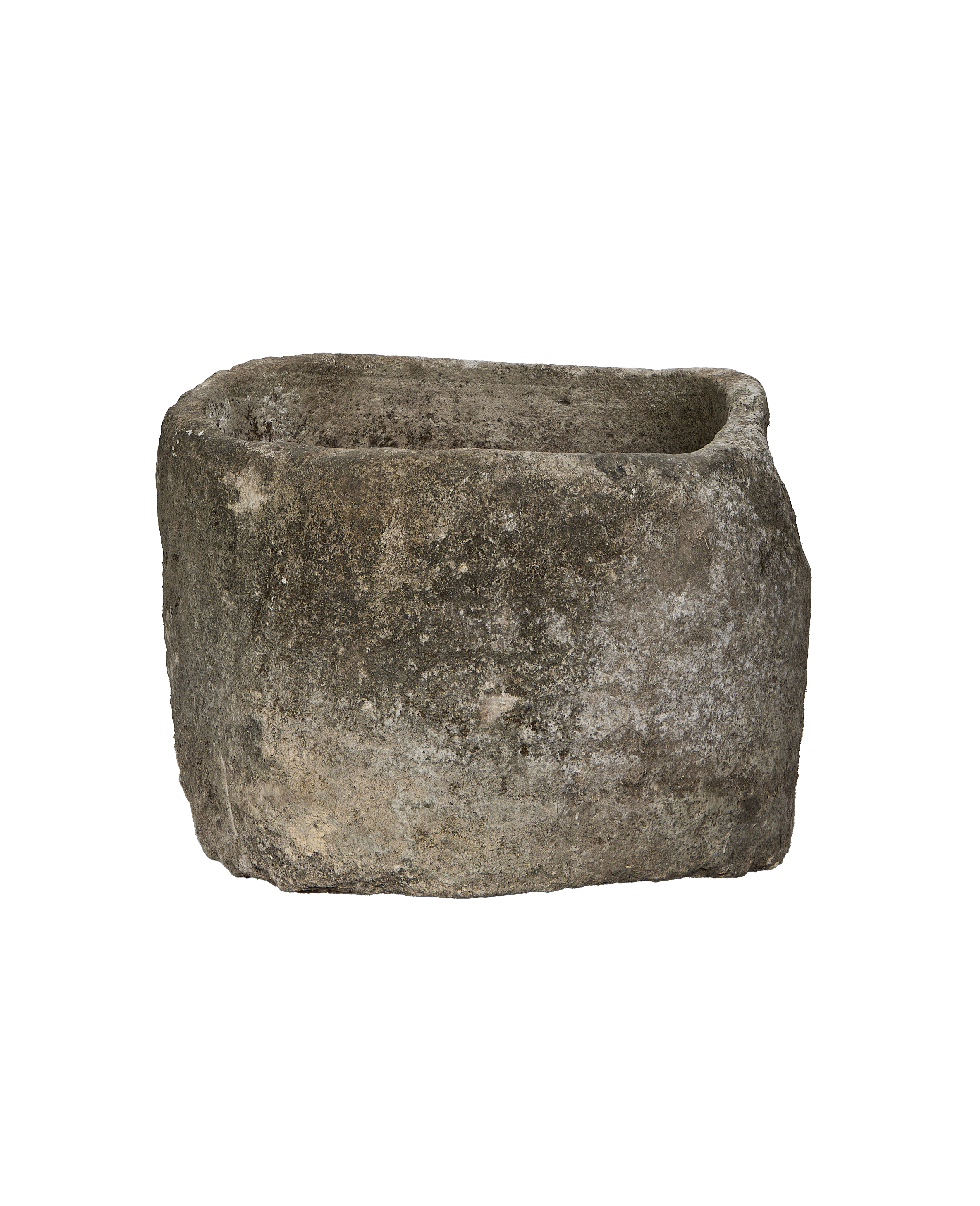 Vintage Indonesian limestone trough, close-up of rough, weathered texture and earthy patina.