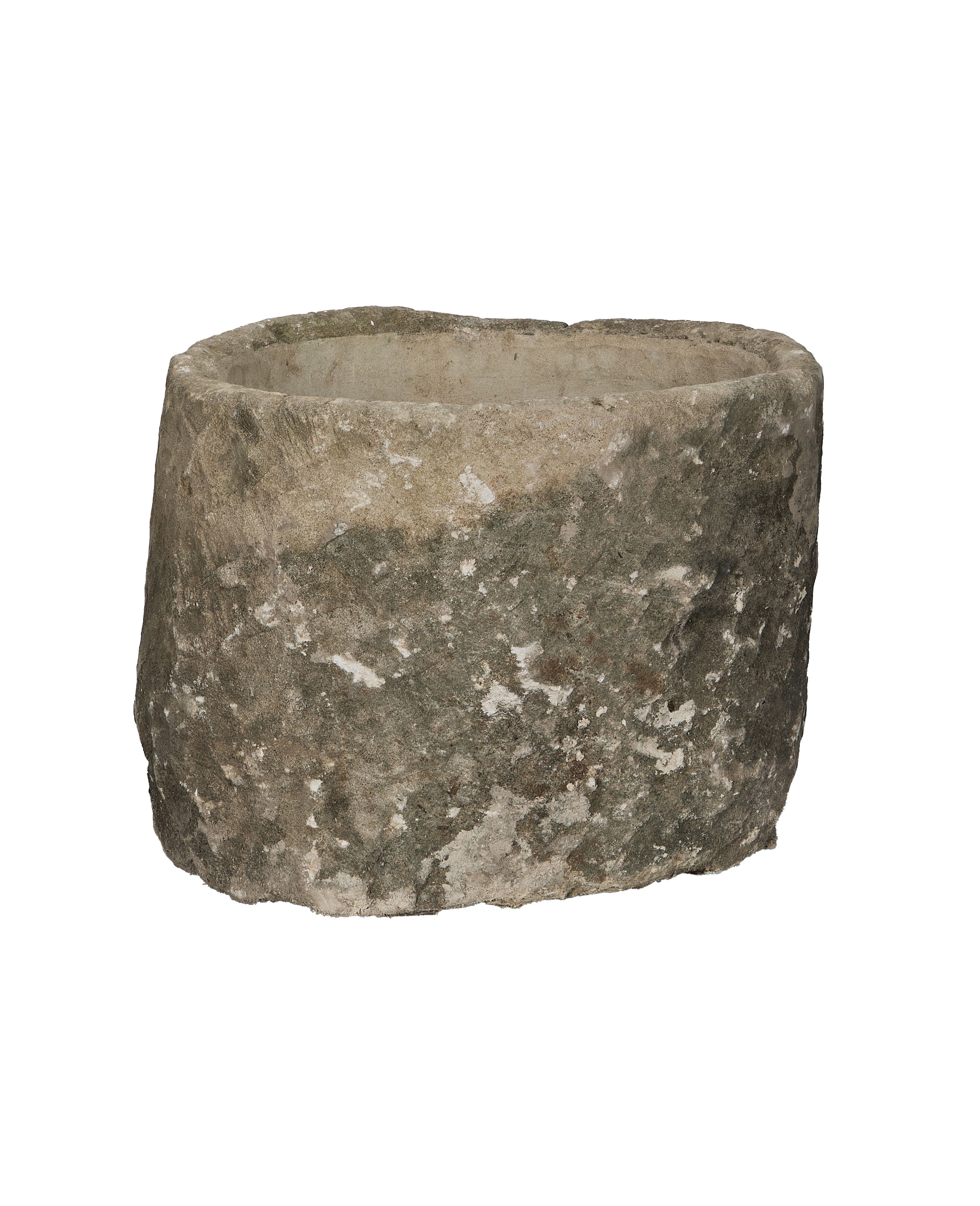 Vintage Indonesian round limestone trough, showing weathered texture from a unique low angle.