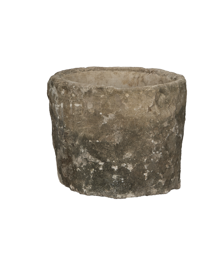 Vintage Indonesian limestone trough, circular, textured exterior with mossy patina, showcasing aged condition.