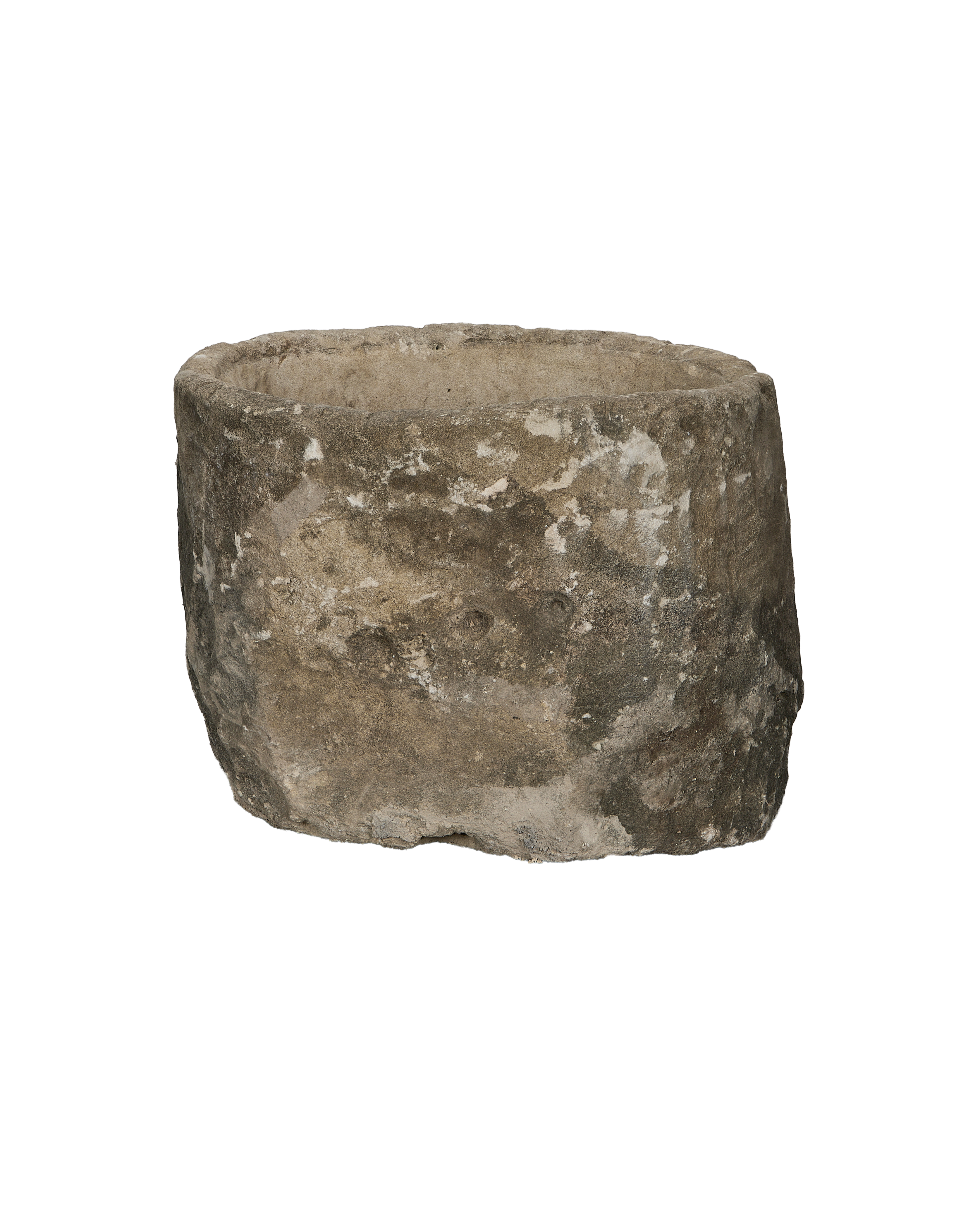 Vintage round limestone trough, side view revealing rustic texture and uneven rim.
