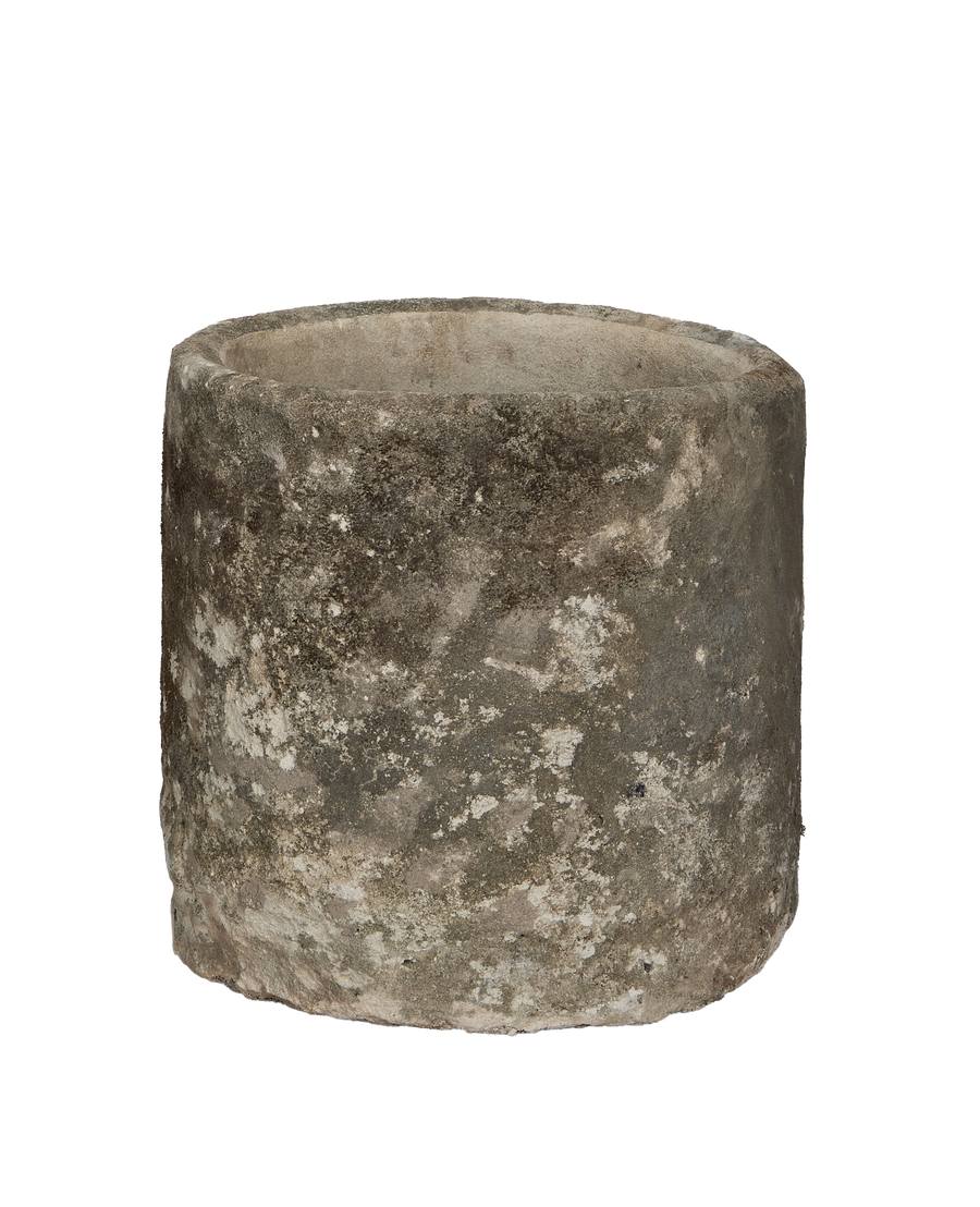 Vintage Indonesian round limestone trough, showing weathered texture and aged patina detail.