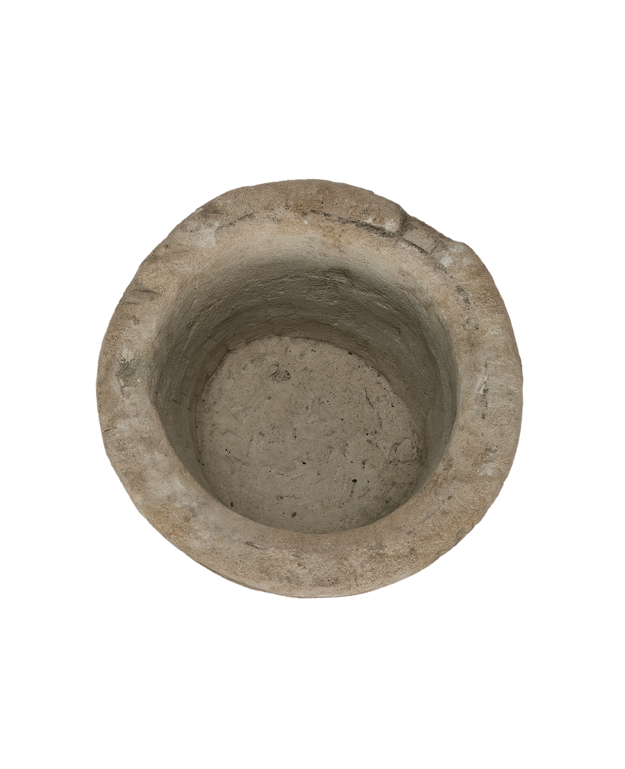 Vintage Indonesian round limestone trough, top-down view showing interior texture.