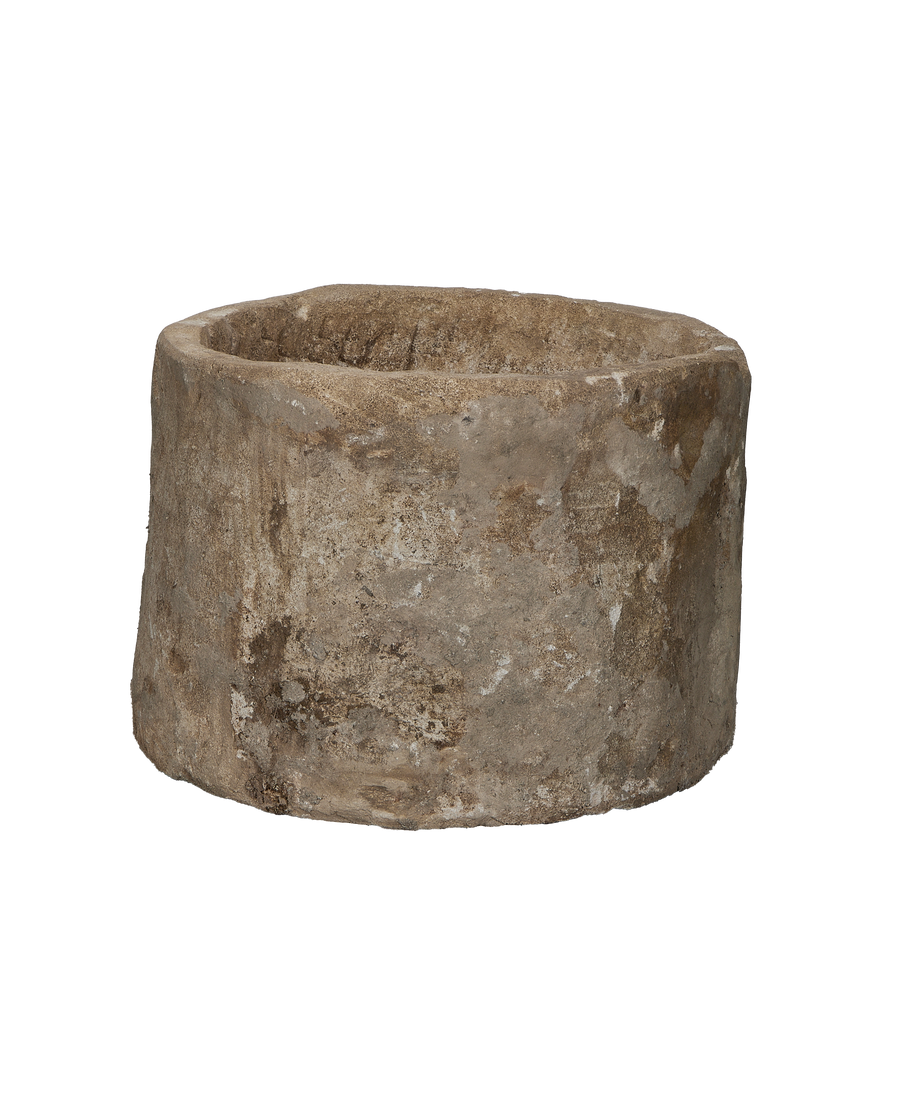 Vintage Indonesian round limestone trough, showing weathered texture and earthy patina.