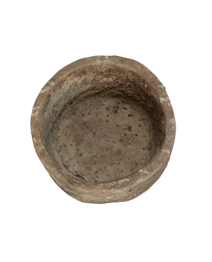 Vintage Indonesian round limestone trough, top-down view showing interior texture and condition.