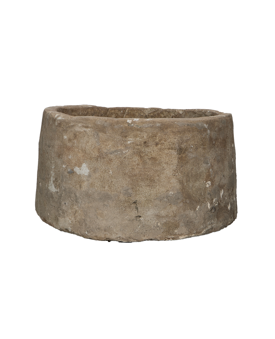 Vintage round Indonesian limestone trough, bottom-view showing weathered surface.