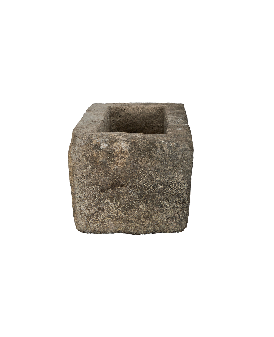 Vintage rectangular limestone trough, close-up revealing aged texture and rustic patina.