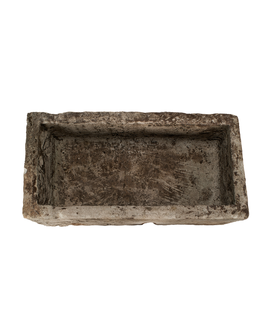 Vintage Indonesian rectangular limestone trough, top view highlights weathered surface, rough texture.