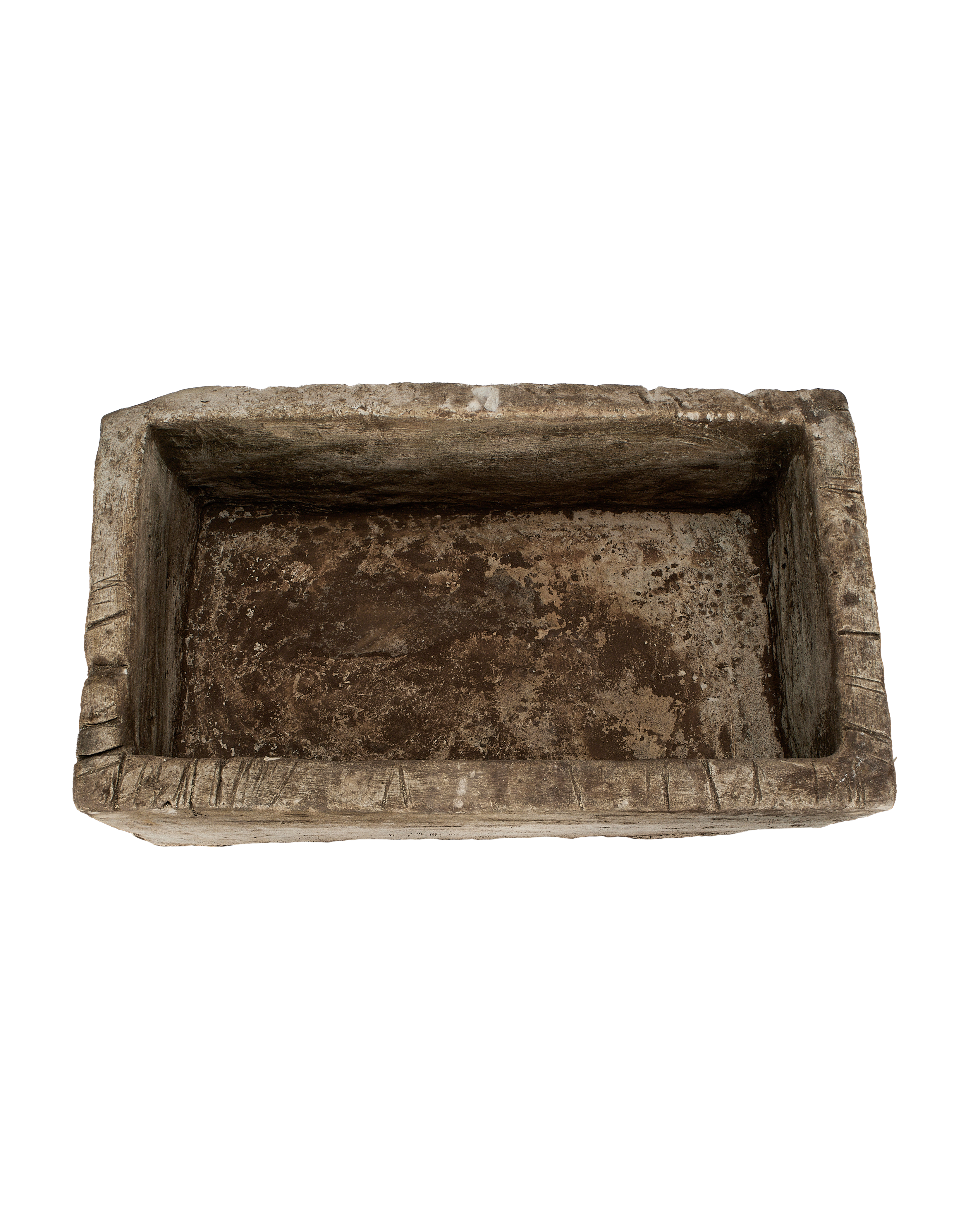 Vintage rectangular limestone trough, showing the rustic interior and chipped edges, from Indonesia.