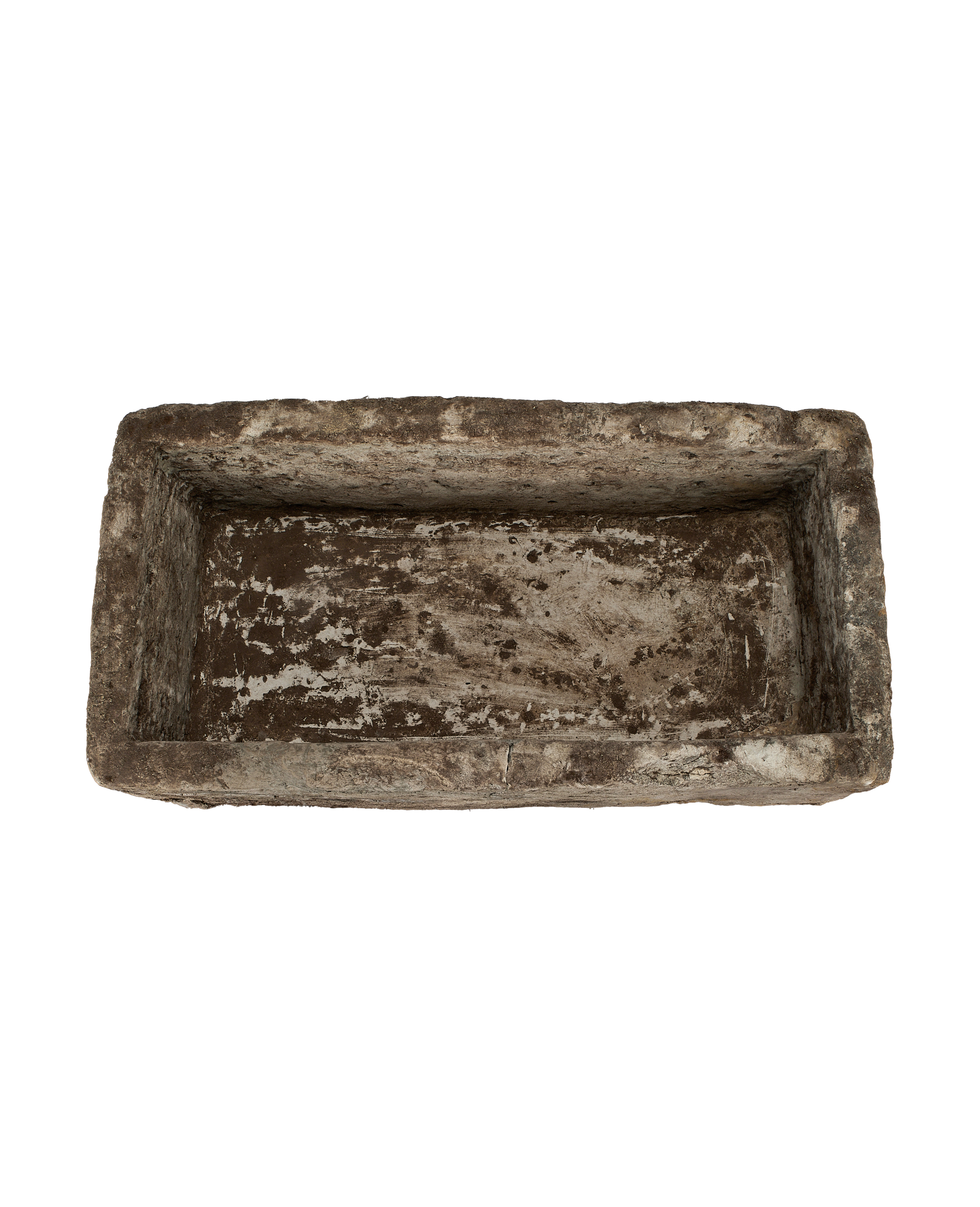 Overhead view of vintage rectangular Indonesian limestone trough with weathered, distressed interior.