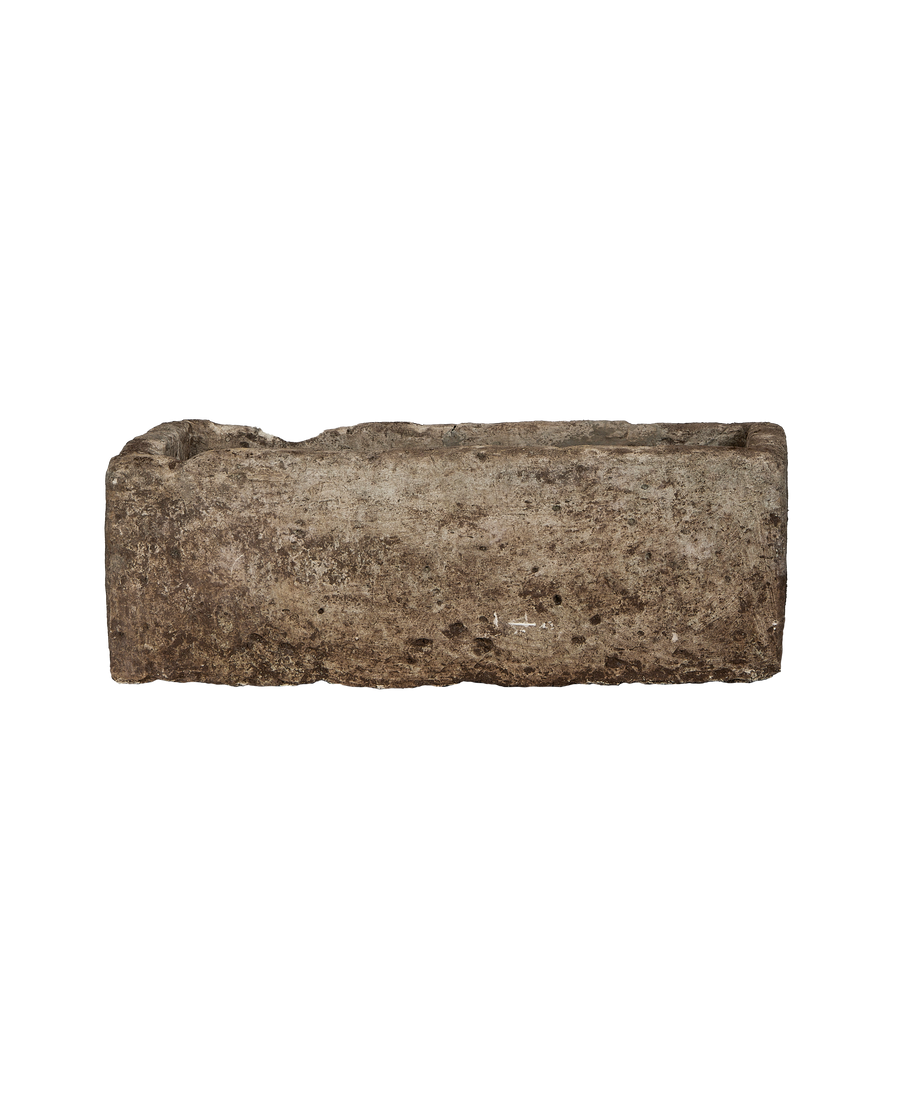 Rectangular vintage Indonesian limestone trough, OAK finish, displaying an aged, textured side profile.