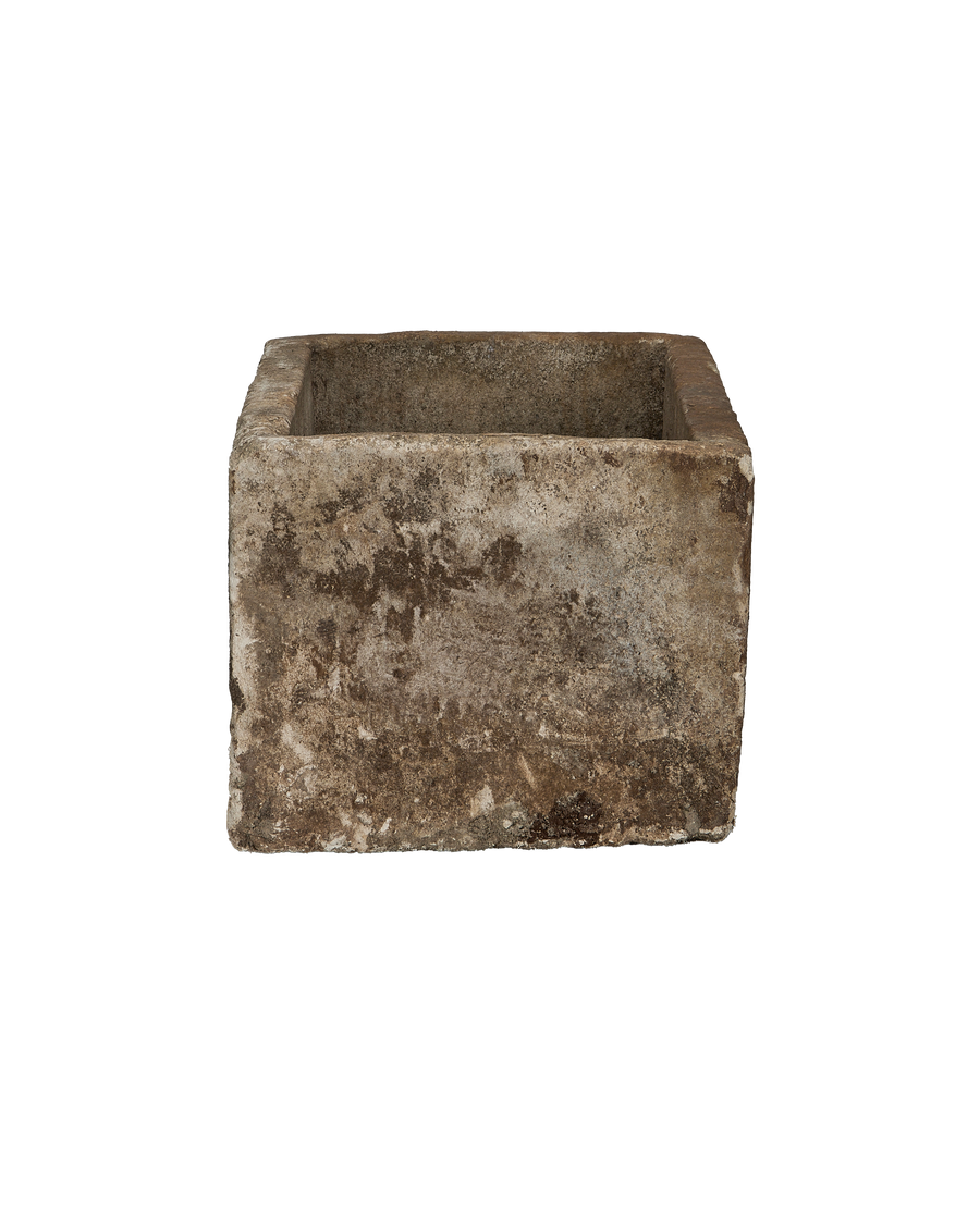 Vintage Indonesian limestone trough, rectangular shape, showcasing distressed gray-brown texture from a lower angle.