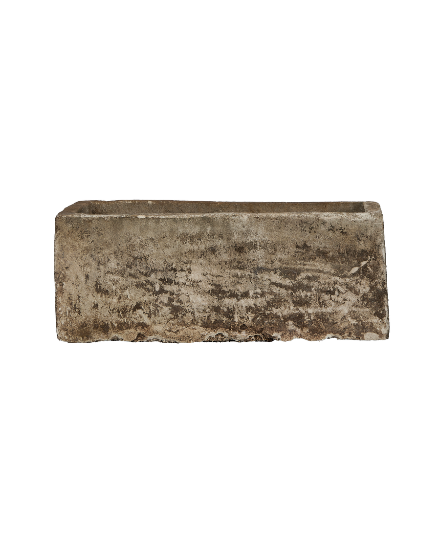 Vintage Indonesian rectangular limestone trough, side profile, rough weathered texture details.