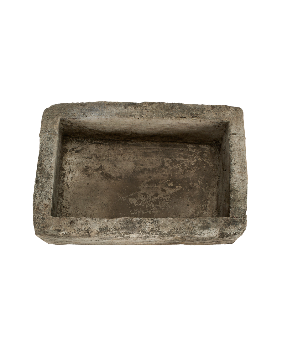 Vintage Indonesian limestone trough, top view showing rectangular interior and weathered texture.