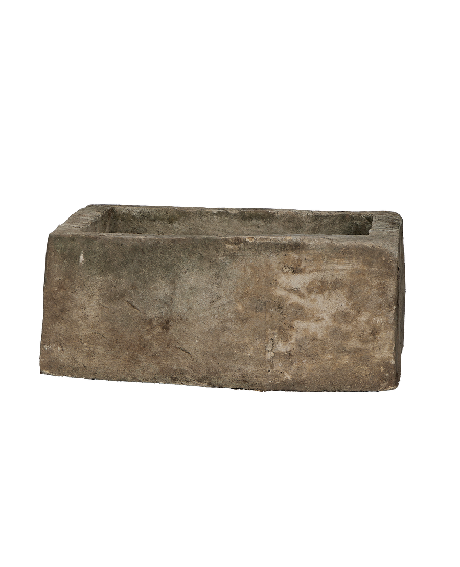 Vintage Indonesian limestone rectangular trough, showing exterior texture and subtle imperfections on its long side.