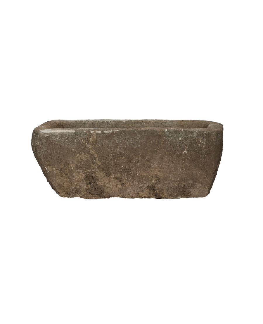 Vintage Indonesian limestone trough, rectangular, showcasing worn texture and aged patina, from a side angle.