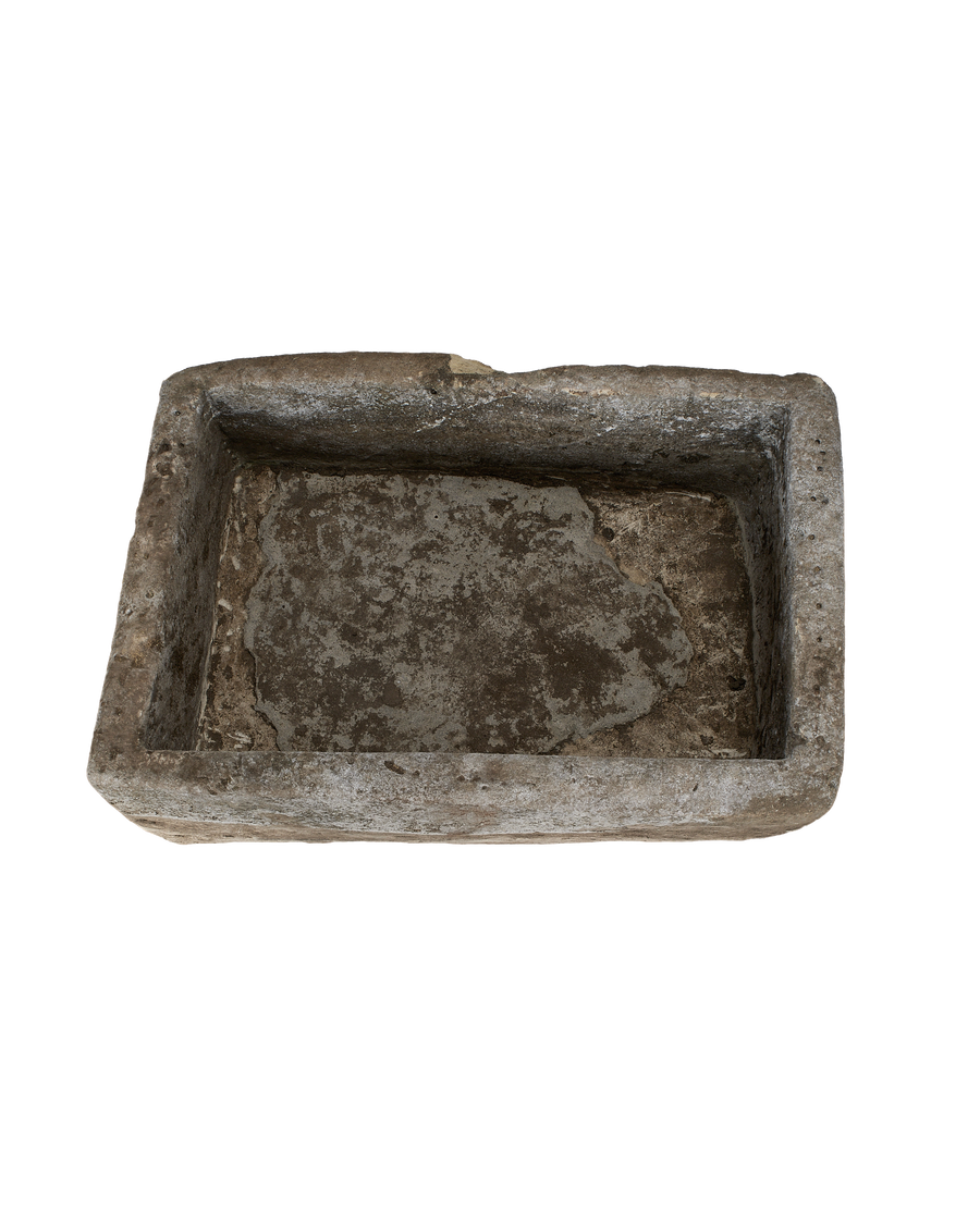 Vintage Indonesian limestone trough bird's-eye view, showcasing rough texture and weathered interior.