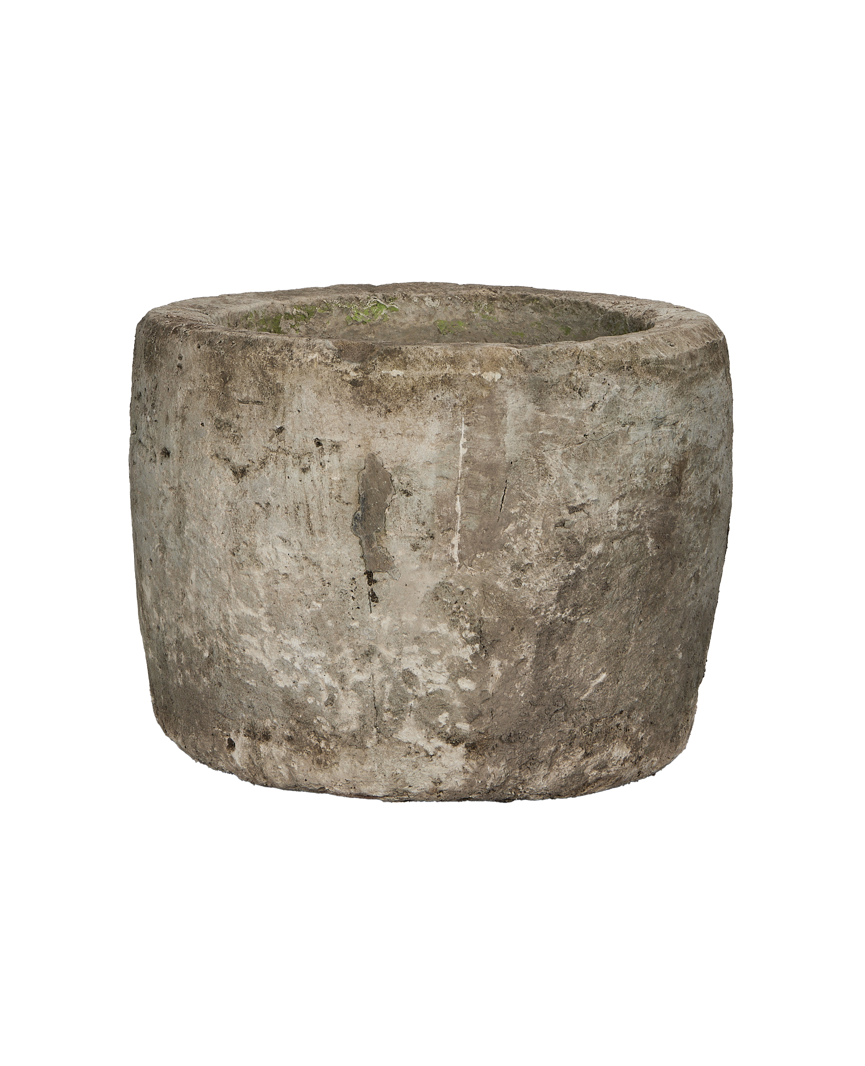 Vintage round limestone trough, side view revealing rustic texture and moss.