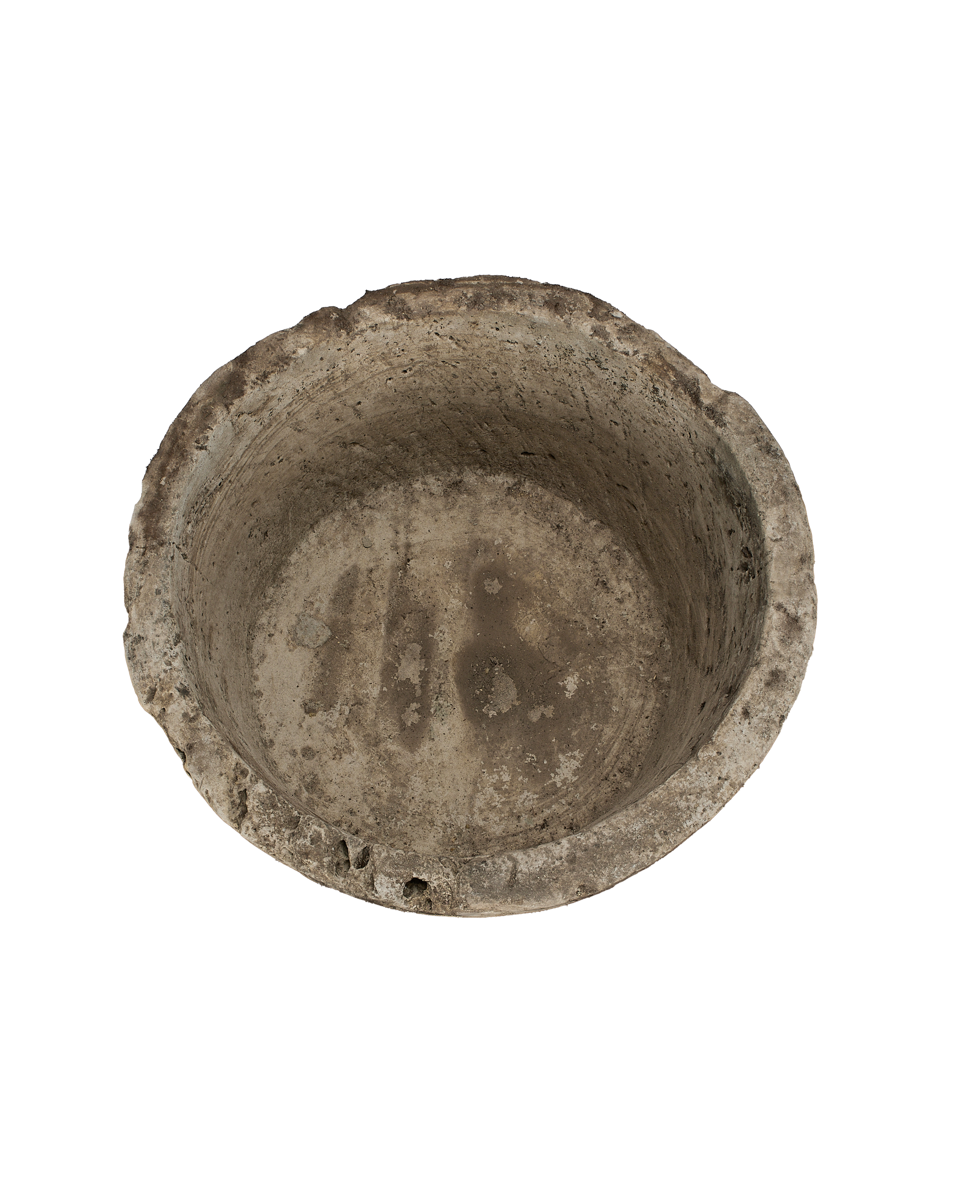 Vintage Indonesian limestone trough, top view of weathered round interior and textured rim.