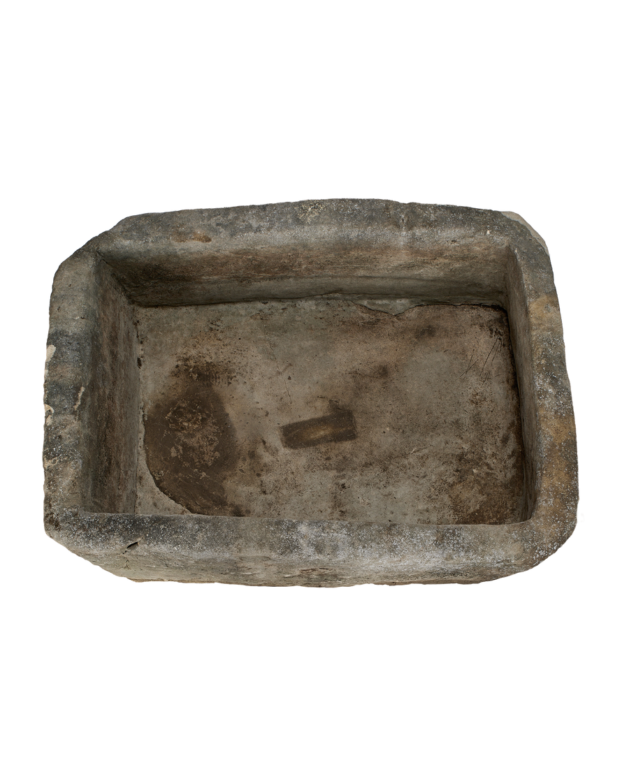 Vintage Indonesian limestone trough, top view, showing rectangular shape and weathered interior.