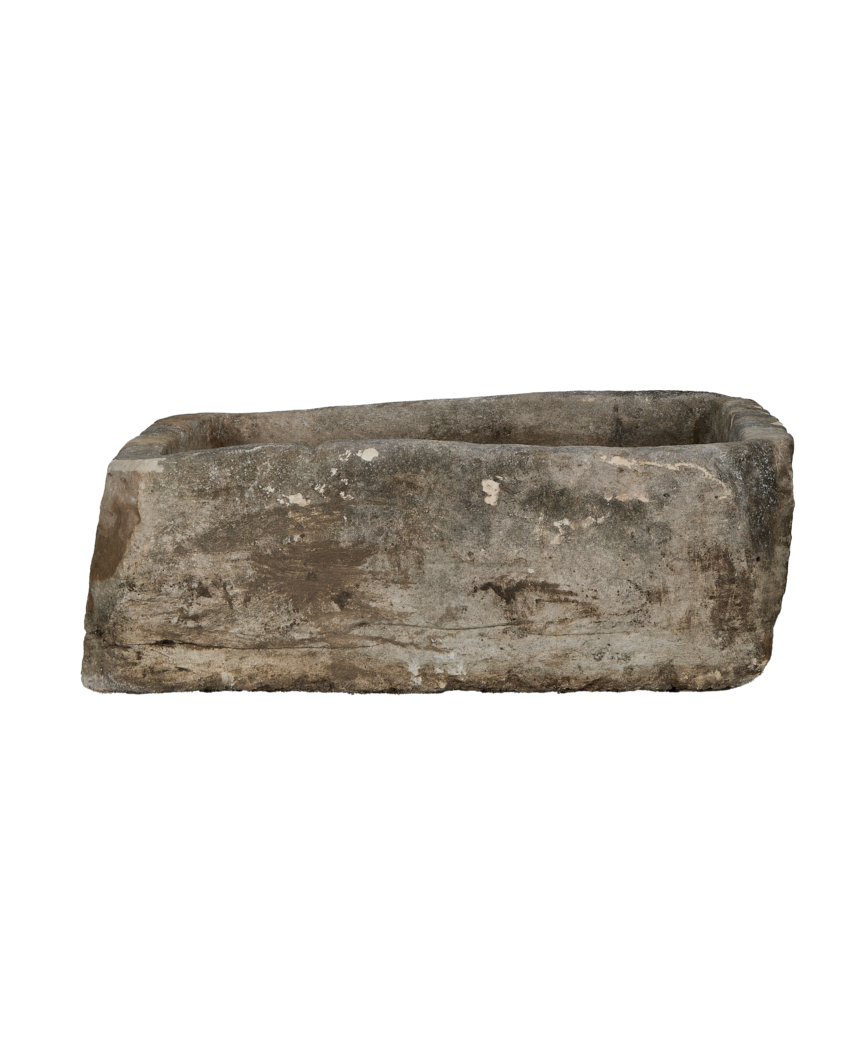 Vintage, rectangular Indonesian limestone trough with weathered, textured surface and worn edges, a side view.