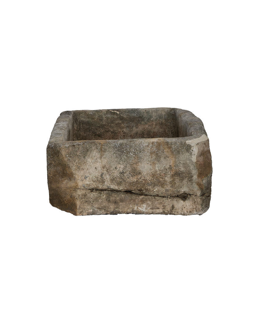 Vintage rectangular limestone trough, Oakland, Indonesia, showing textured side with natural crack detail.