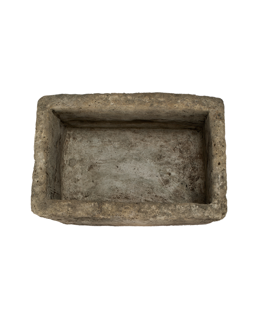 Vintage rectangular limestone trough, top view showing weathered, texture-rich interior.