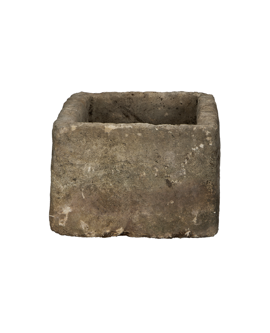 Vintage Indonesian limestone trough, rectangular, OAK, with textured, weathered exterior from front view.