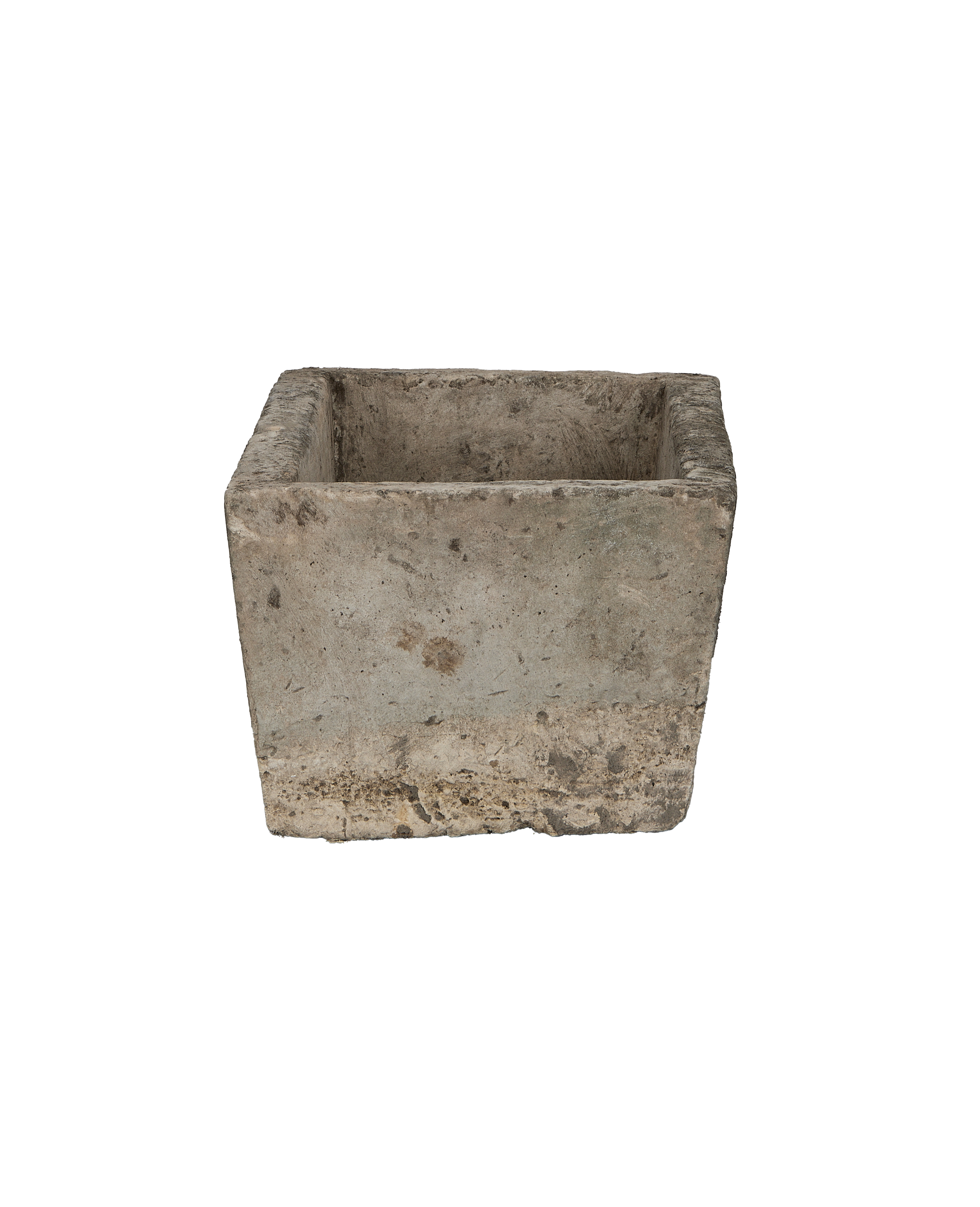 Vintage Indonesian limestone trough viewed from the side, showing rough texture and weathered edges.
