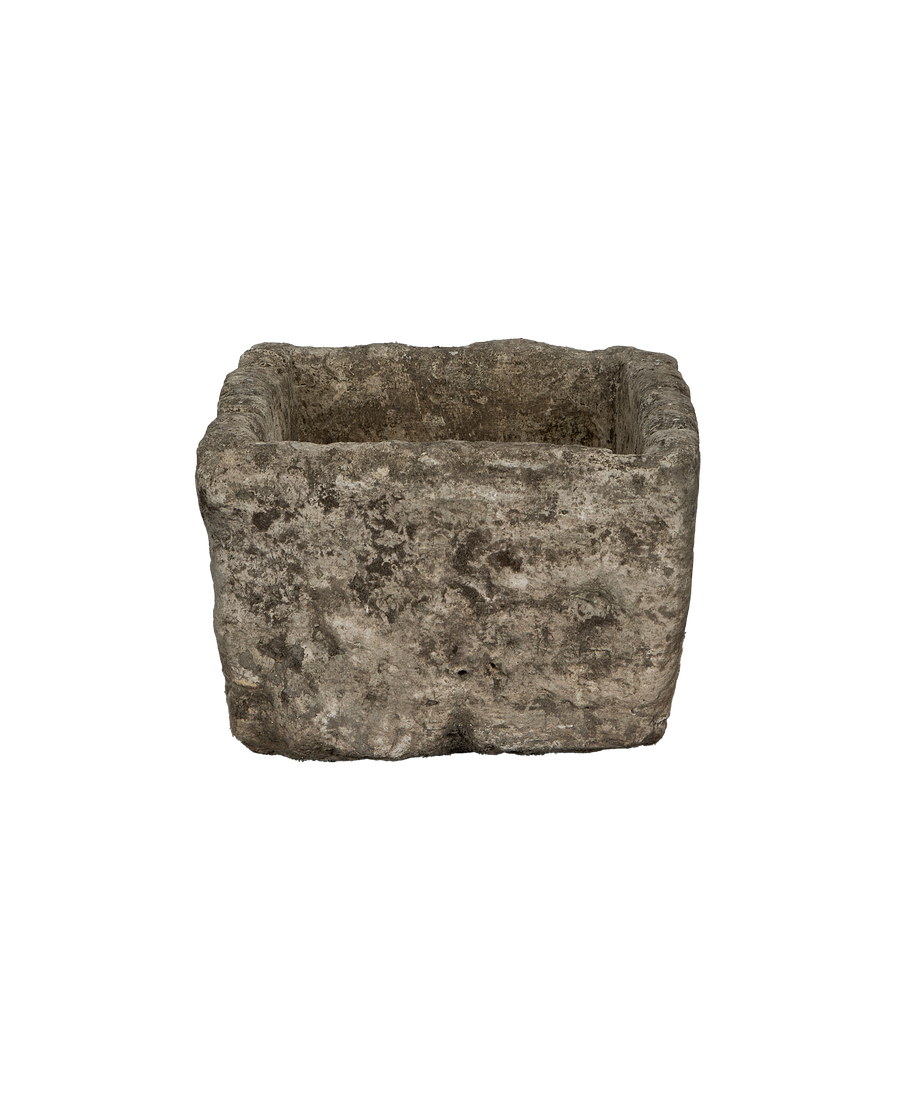 Vintage Indonesian limestone trough (OAK) from above, showcasing rough-hewn texture and rectangular shape.