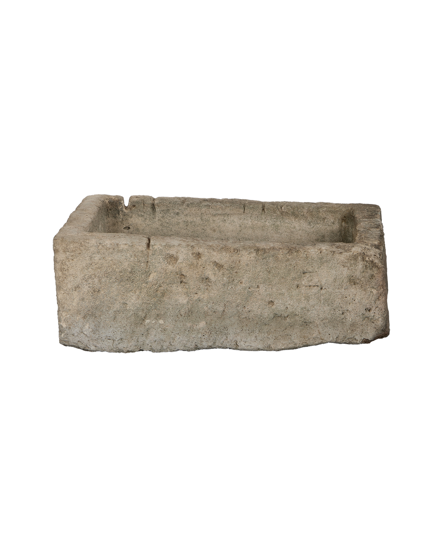 Vintage Indonesian rectangular limestone trough, rustic condition, side view showing interior depth.