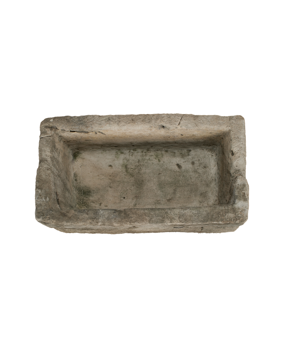 Vintage rectangular Jakarta limestone trough, top-down view showing interior algae and weathered texture.