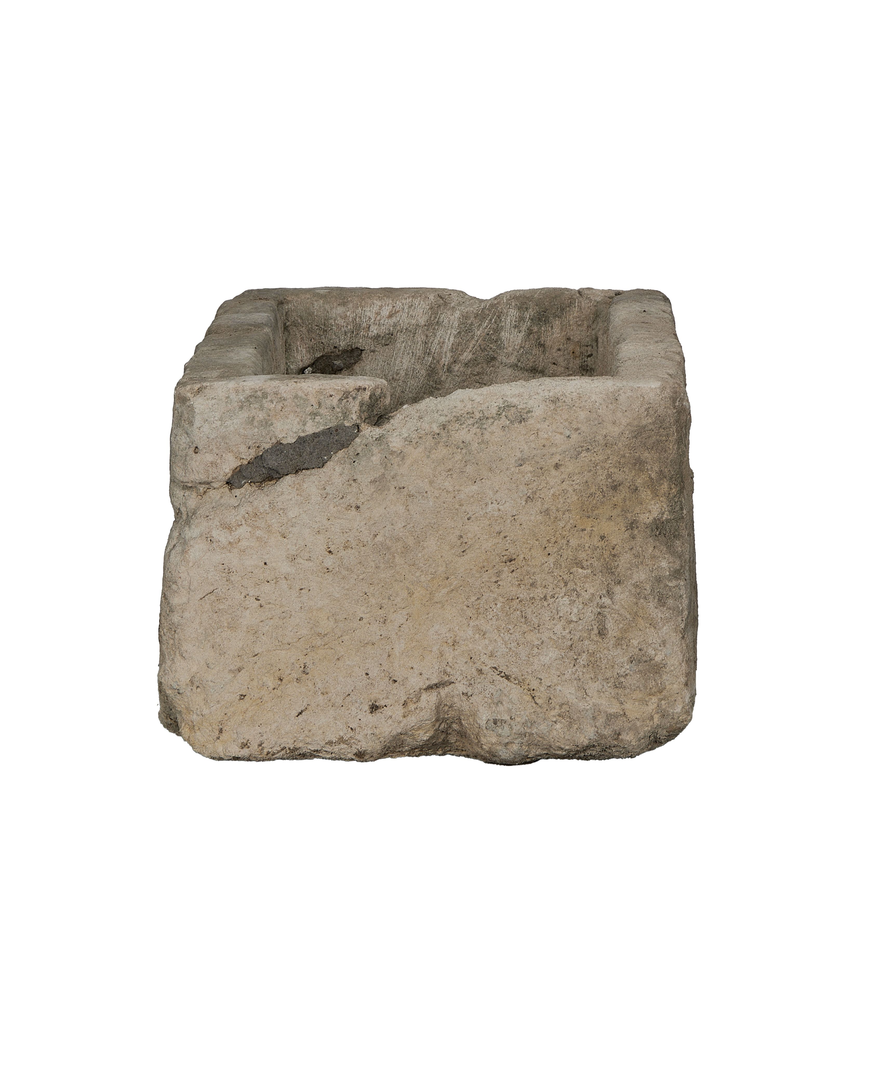 Vintage Indonesian limestone trough closeup, featuring rough texture and unique weathered interior.