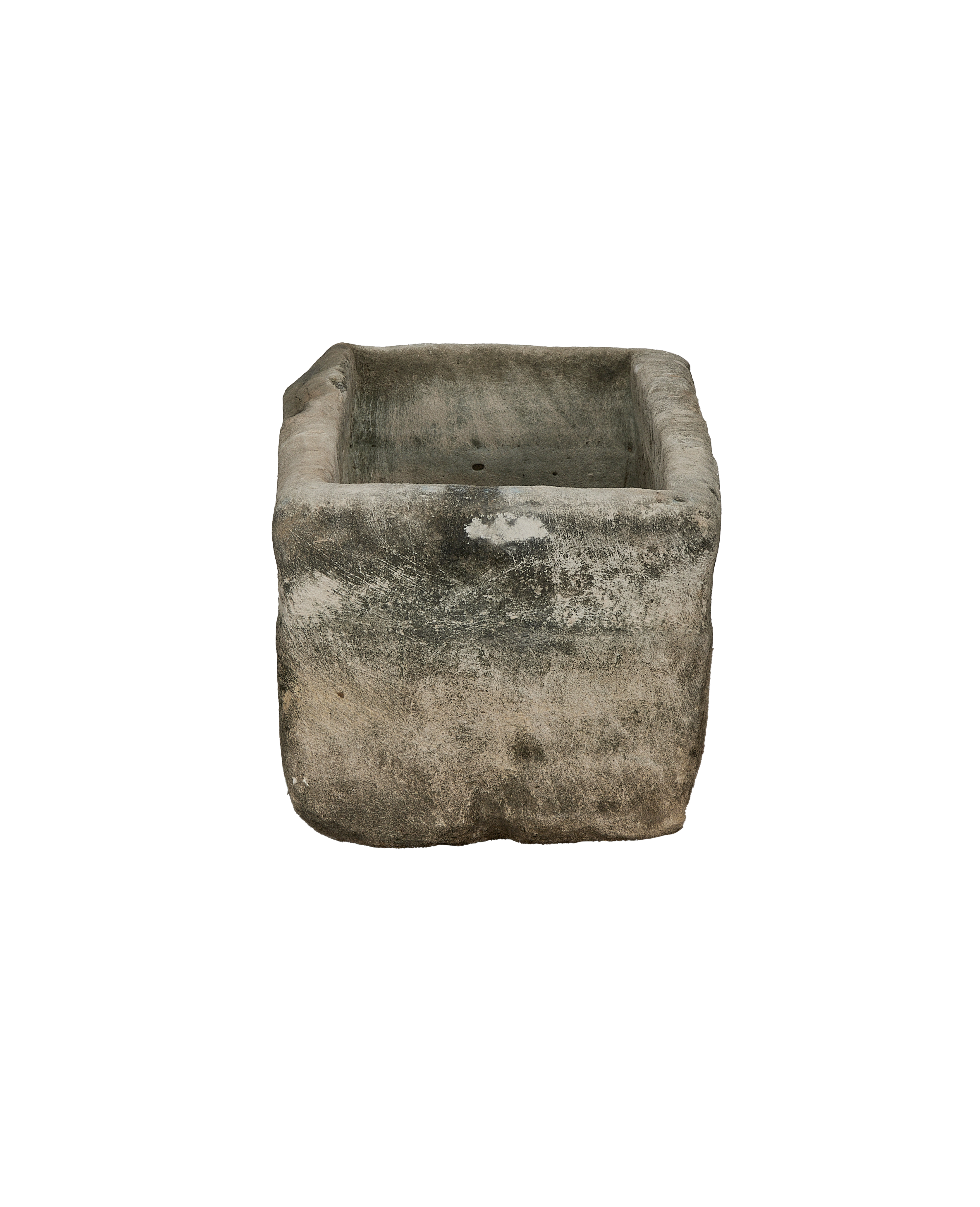 Vintage rectangular limestone trough, viewed from above, showing weathered gray-green interior with drainage holes.