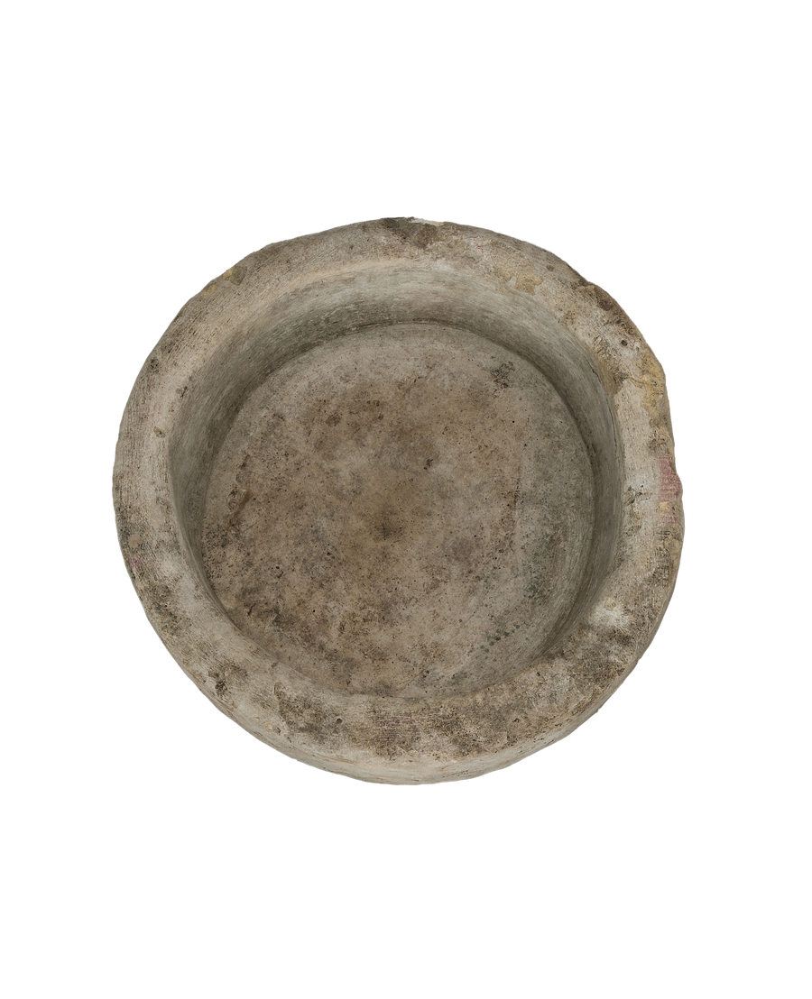 Round vintage limestone trough, overall aerial view of the worn interior surface.