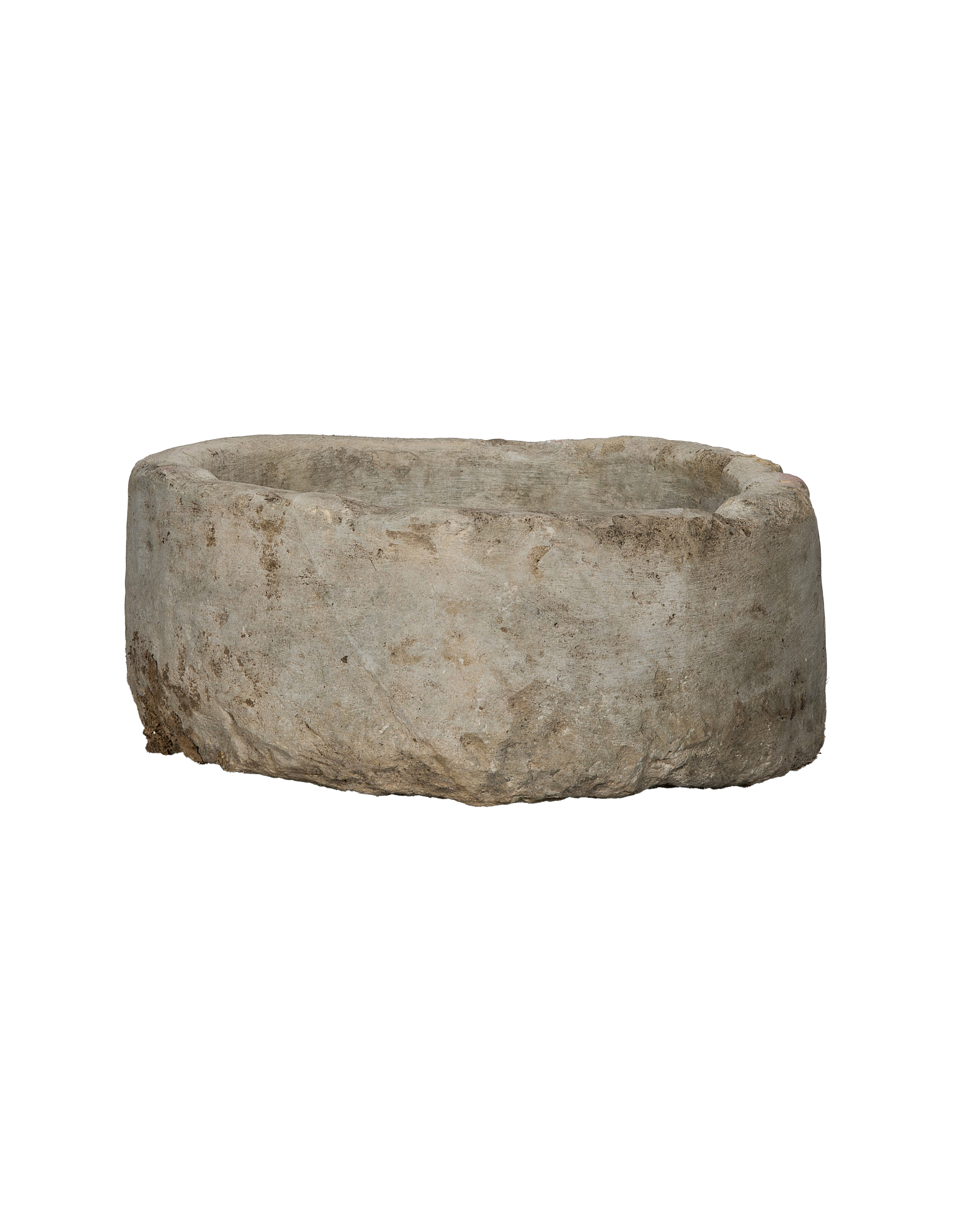 Vintage Indonesian round limestone trough, aged grey with textured surface, on black background.