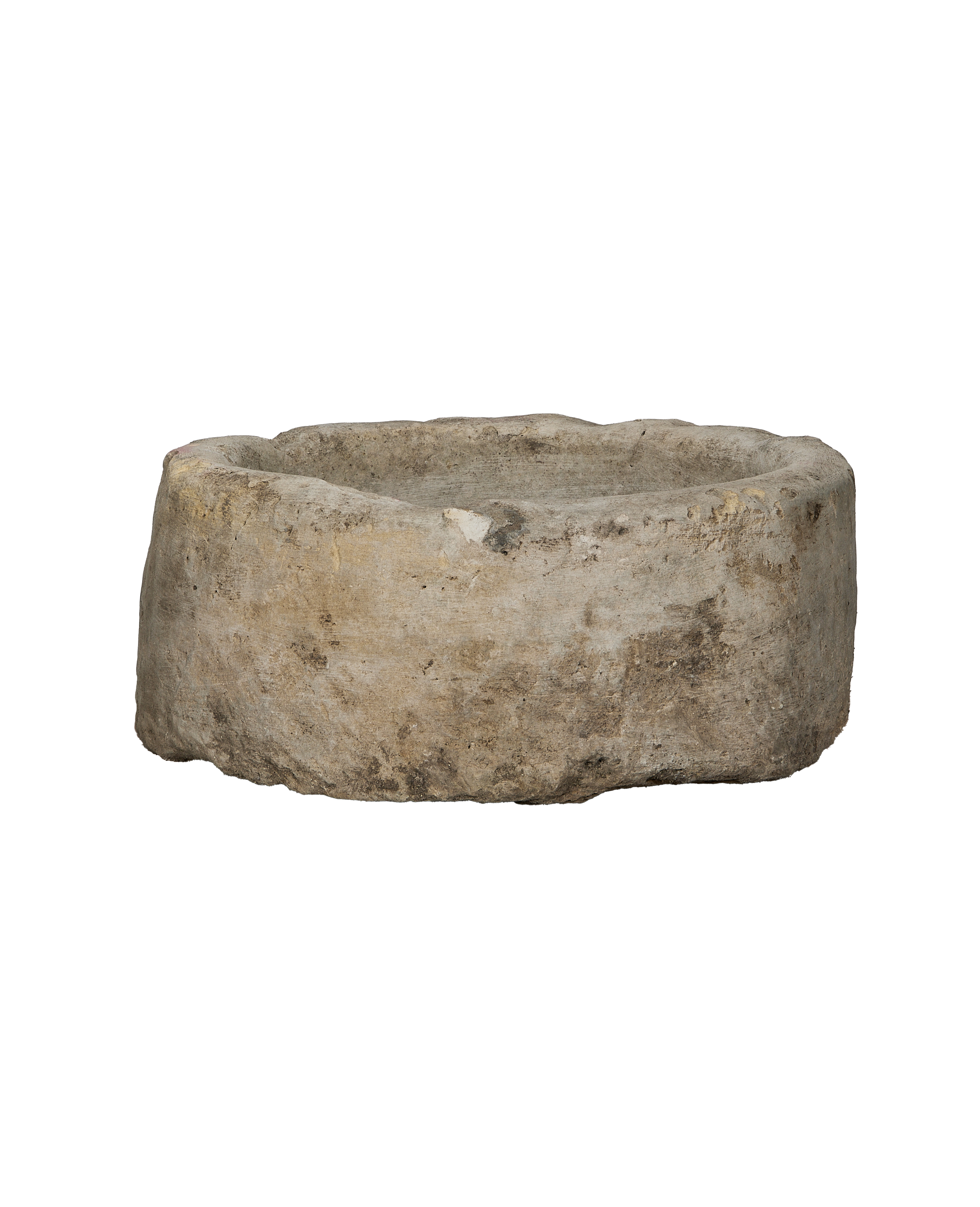 Round vintage Indonesian limestone trough showcasing weathered texture and irregular top rim.