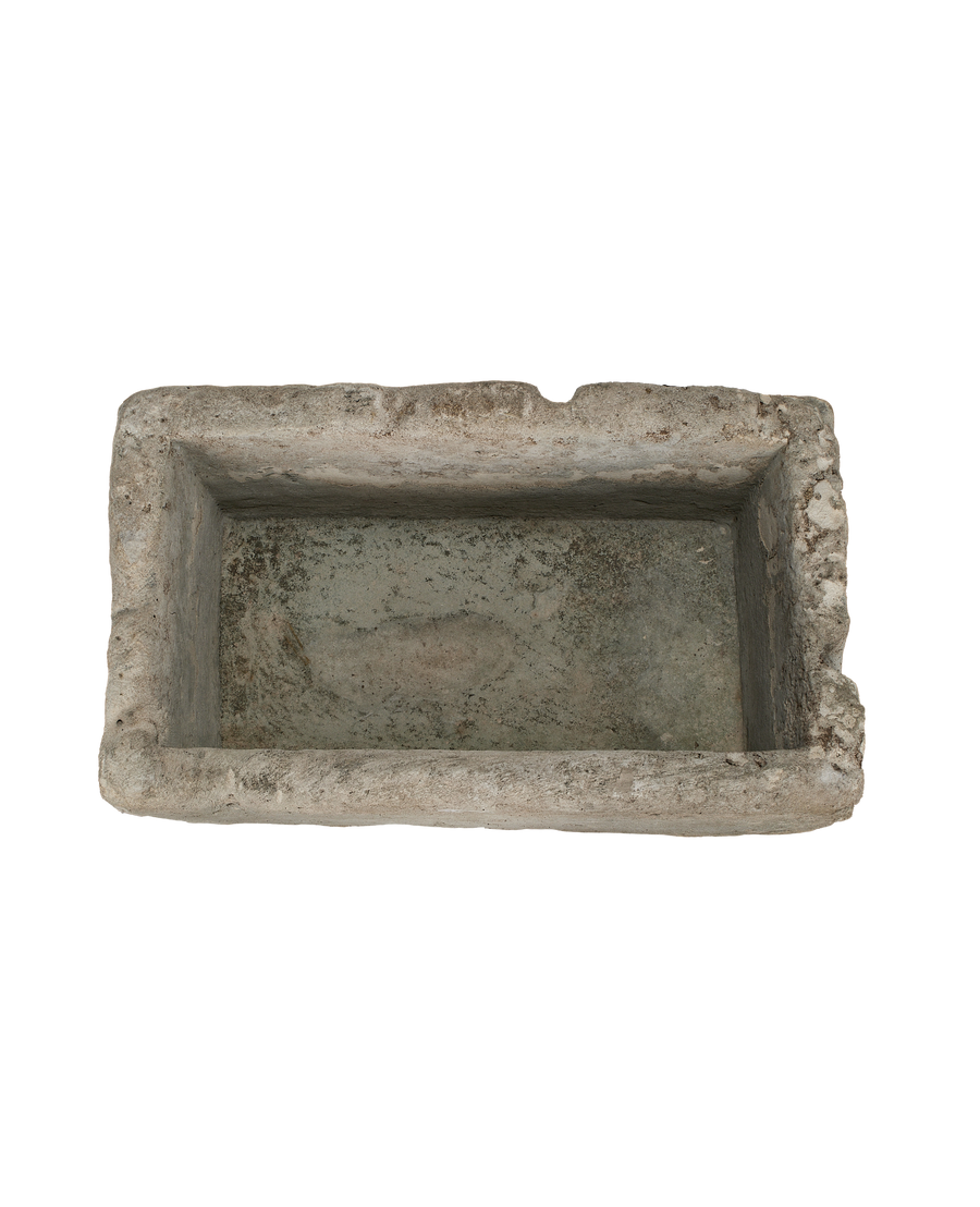 Vintage rectangular Indonesian limestone trough, top-down view showing interior basin texture.