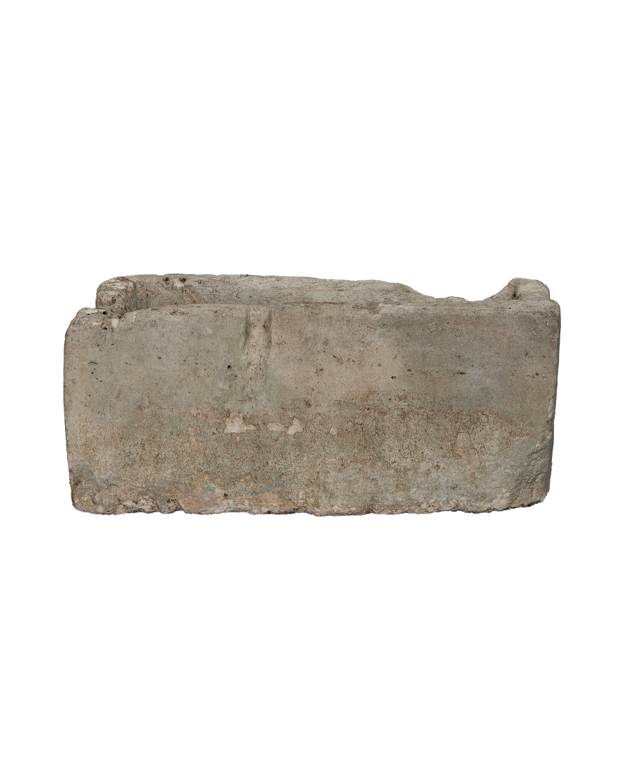 Vintage Indonesian limestone trough, rectangular, rough textured surface with worn edges.